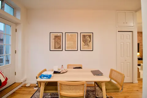 a view of a dining room with furniture and a table