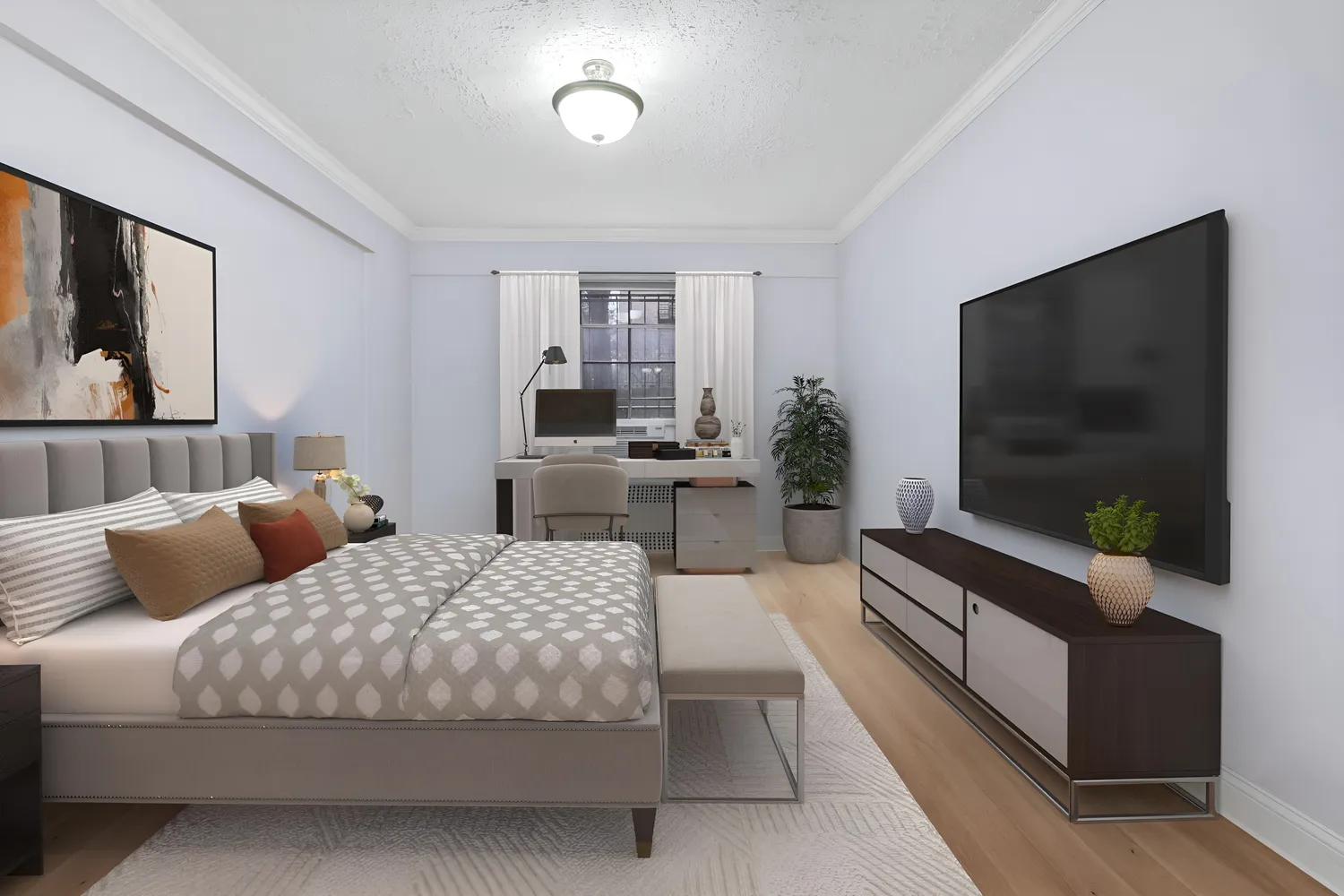 a bedroom with a bed and a flat screen television