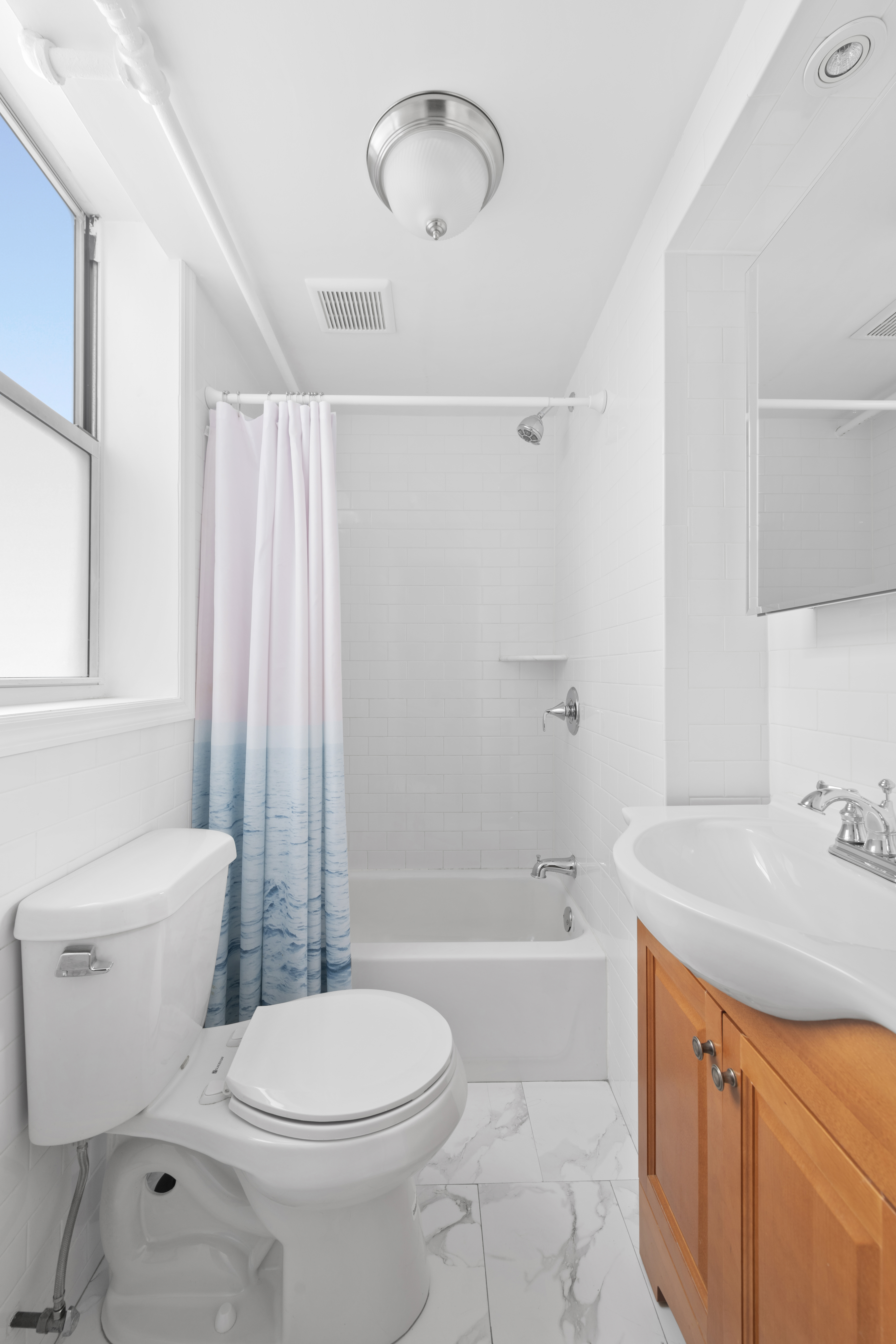 20 Devoe Street, Unit GF Brooklyn, NY 11211 - Photo 5 of 6 a bathroom with a sink toilet and shower