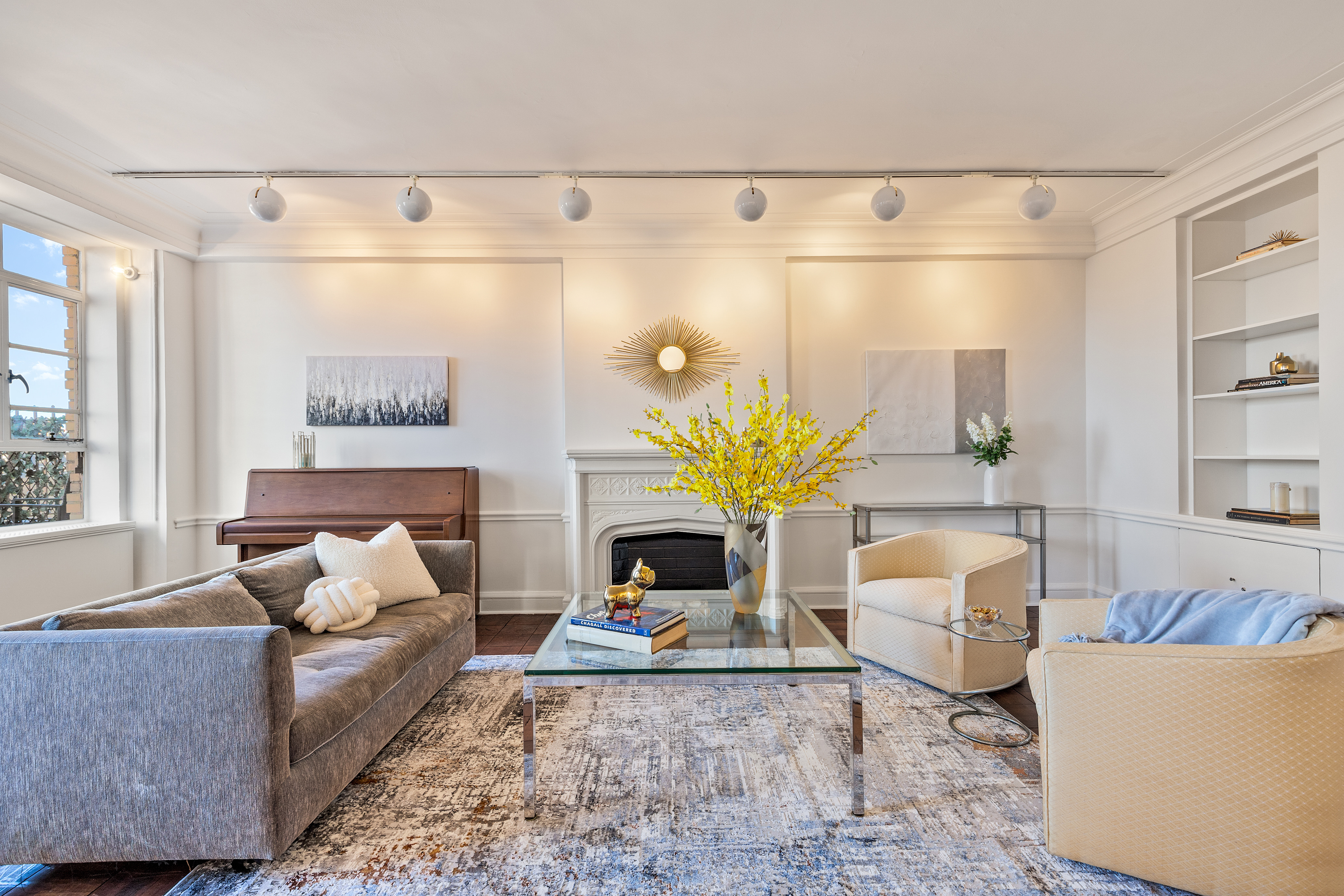 115 Central Park West, Unit 16H Manhattan, NY 10023 - Photo 3 of 30 a living room with furniture and wooden floor