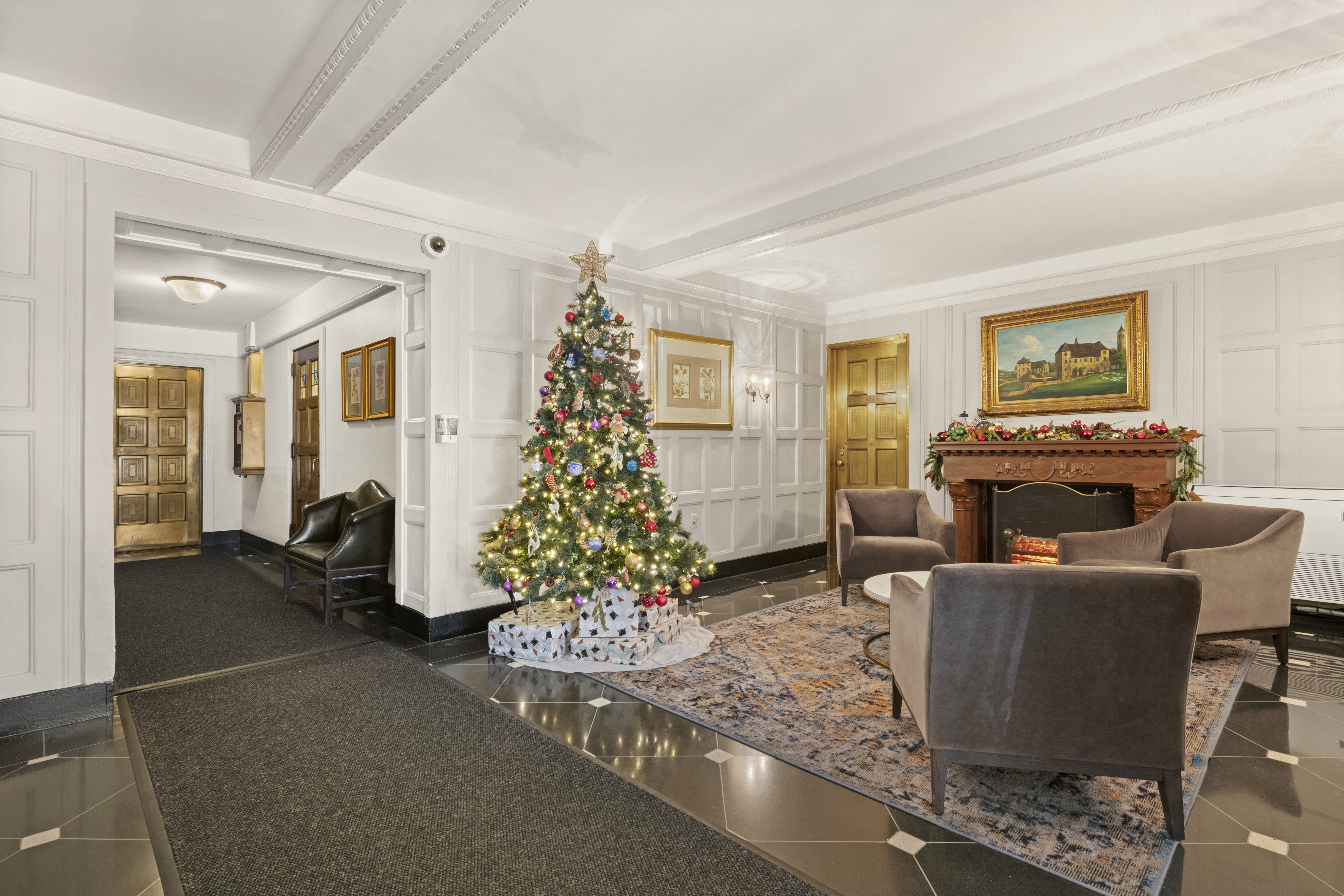 245 East 72nd Street, Unit 6F Manhattan, NY 10021 - Photo 8 of 9 a living room with furniture and a chandelier