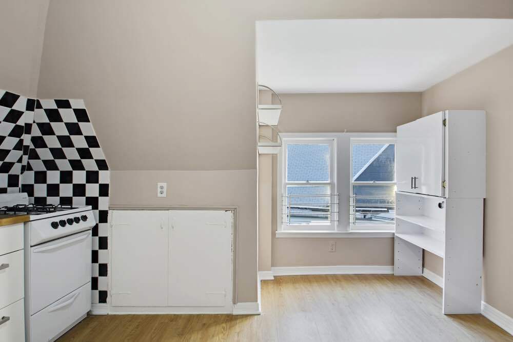1617 Dorchester Road, Unit 3 Brooklyn, NY 11226 - Photo 3 of 6 a view of kitchen with furniture and window