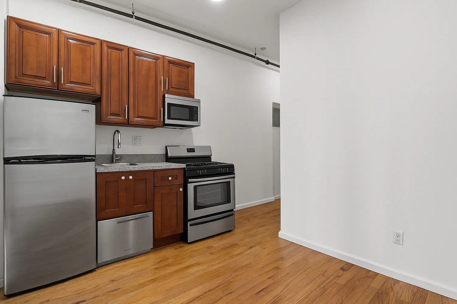 a kitchen with granite countertop wooden cabinets stainless steel appliances and a wooden floor