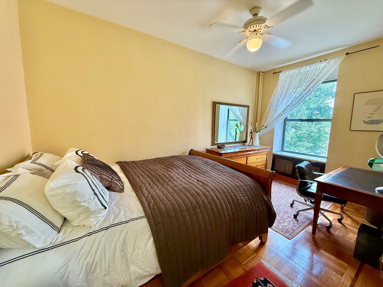 46 St Marks Place, Unit 7 Manhattan, NY 10003 - Photo 4 of 7 a bedroom with a bed and a table