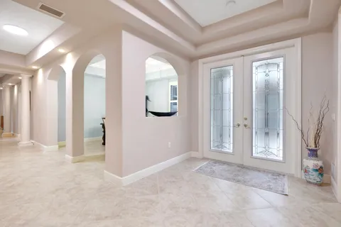 an empty room with windows and closet