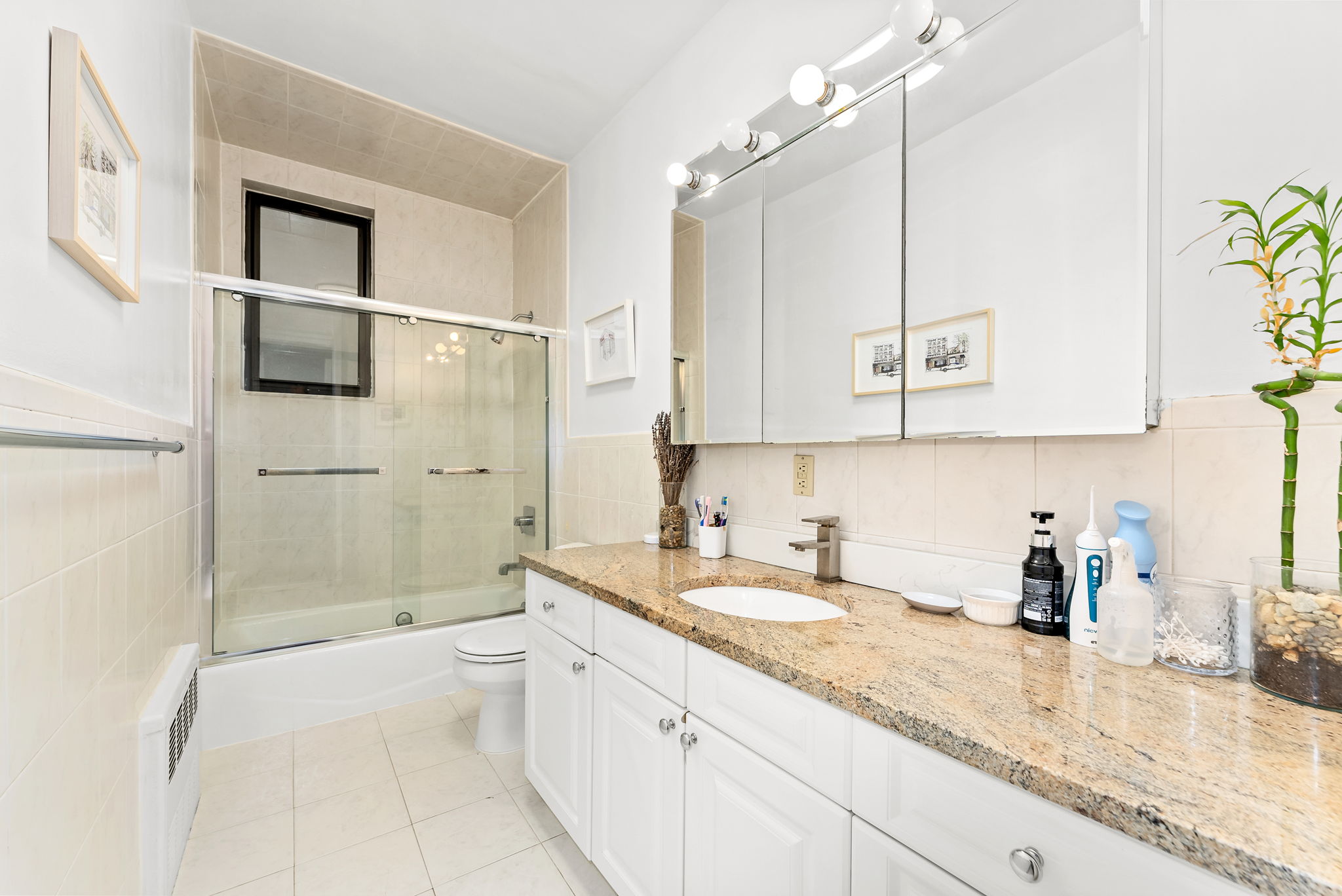 461 3rd Street, Unit 3L Brooklyn, NY 11215 - Photo 8 of 10 a bathroom with a granite countertop sink mirror vanity and bathtub