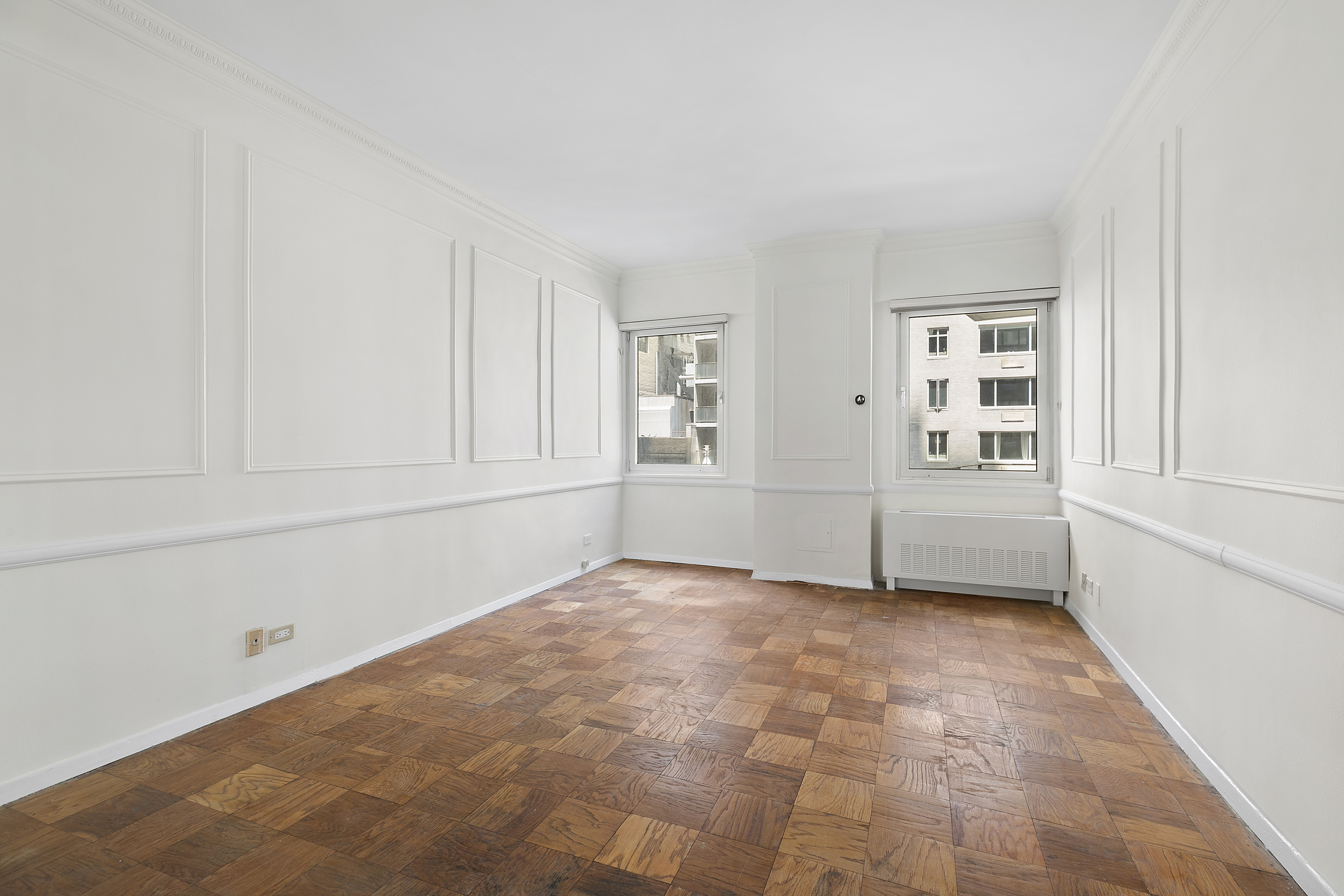 58 West 58th Street, Unit 4C Manhattan, NY 10019 - Photo 12 of 14 a view of an empty room with a window