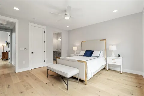a bathroom with a sink a light fixture and a mirror