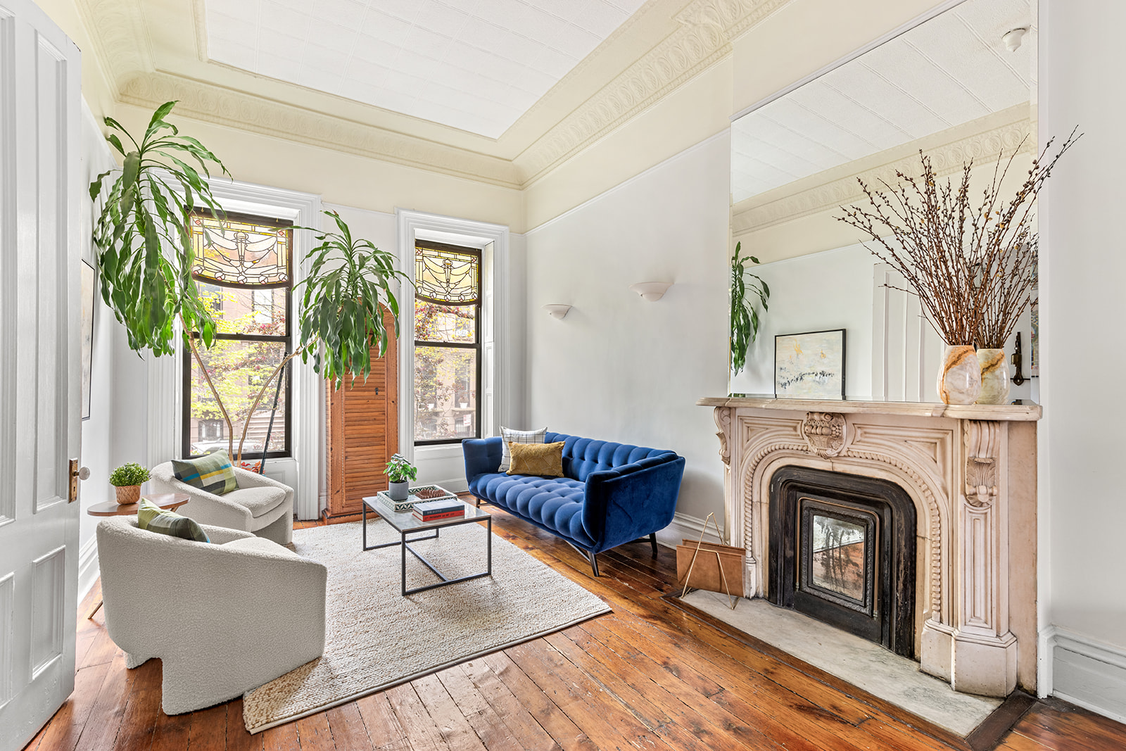 417 6th Street Brooklyn, NY 11215 - Photo 3 of 21 a living room with furniture a large window and a fireplace
