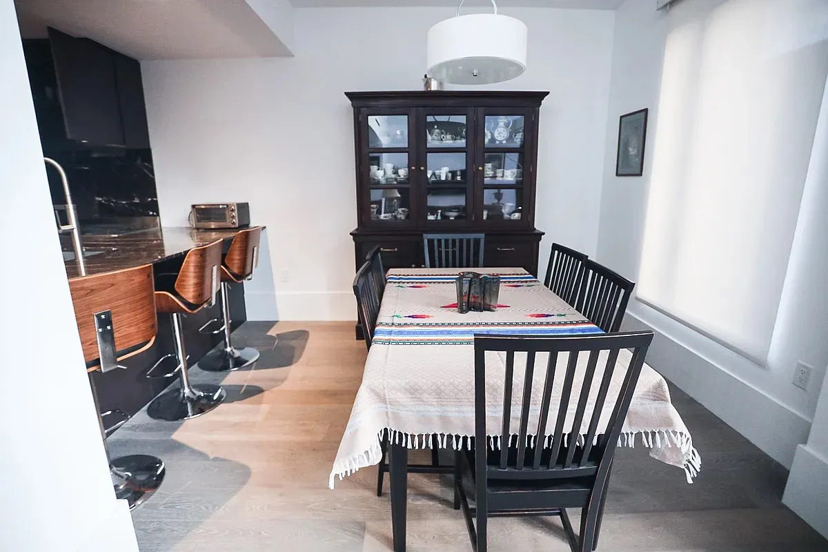 a view of a dining room with furniture and window