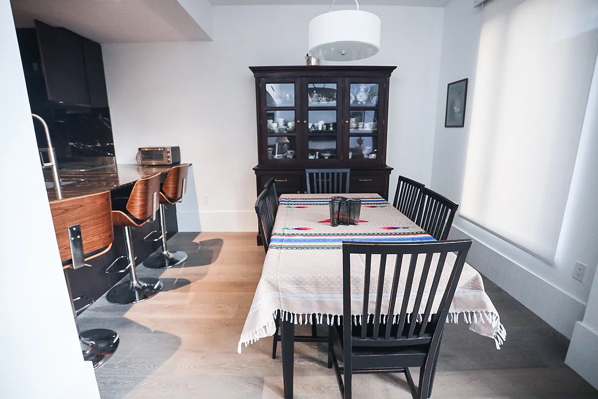 429 Kent Avenue, Unit D722 Brooklyn, NY 11249 - Photo 5 of 18 a view of a dining room with furniture and window
