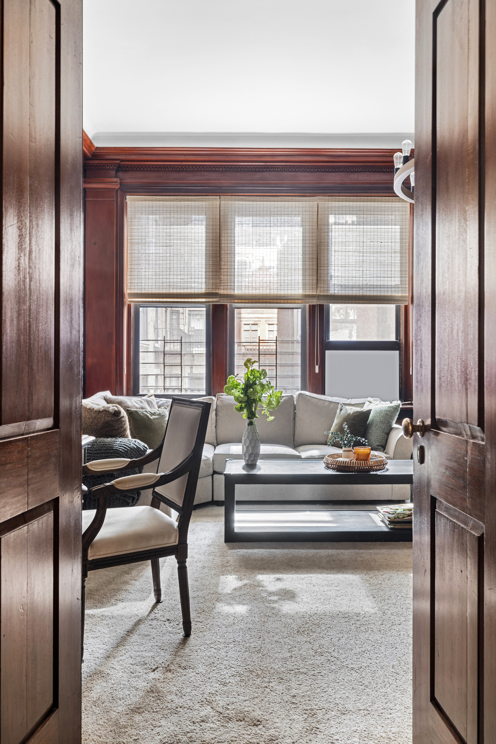 107 East 38th Street, Unit 2AB Manhattan, NY 10016 - Photo 10 of 13 a living room with furniture and a potted plant