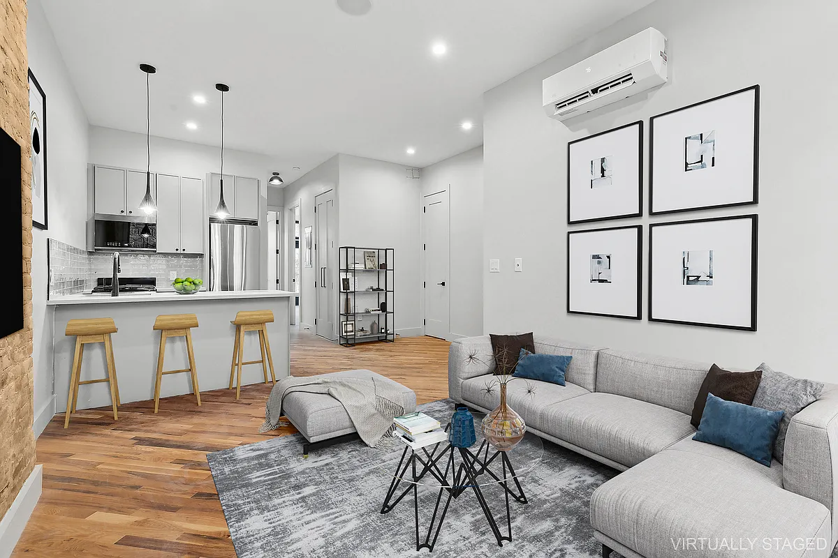 1265 Madison Street, Unit 2 Brooklyn, NY 11221 - Photo 2 of 9 a living room with furniture and kitchen view