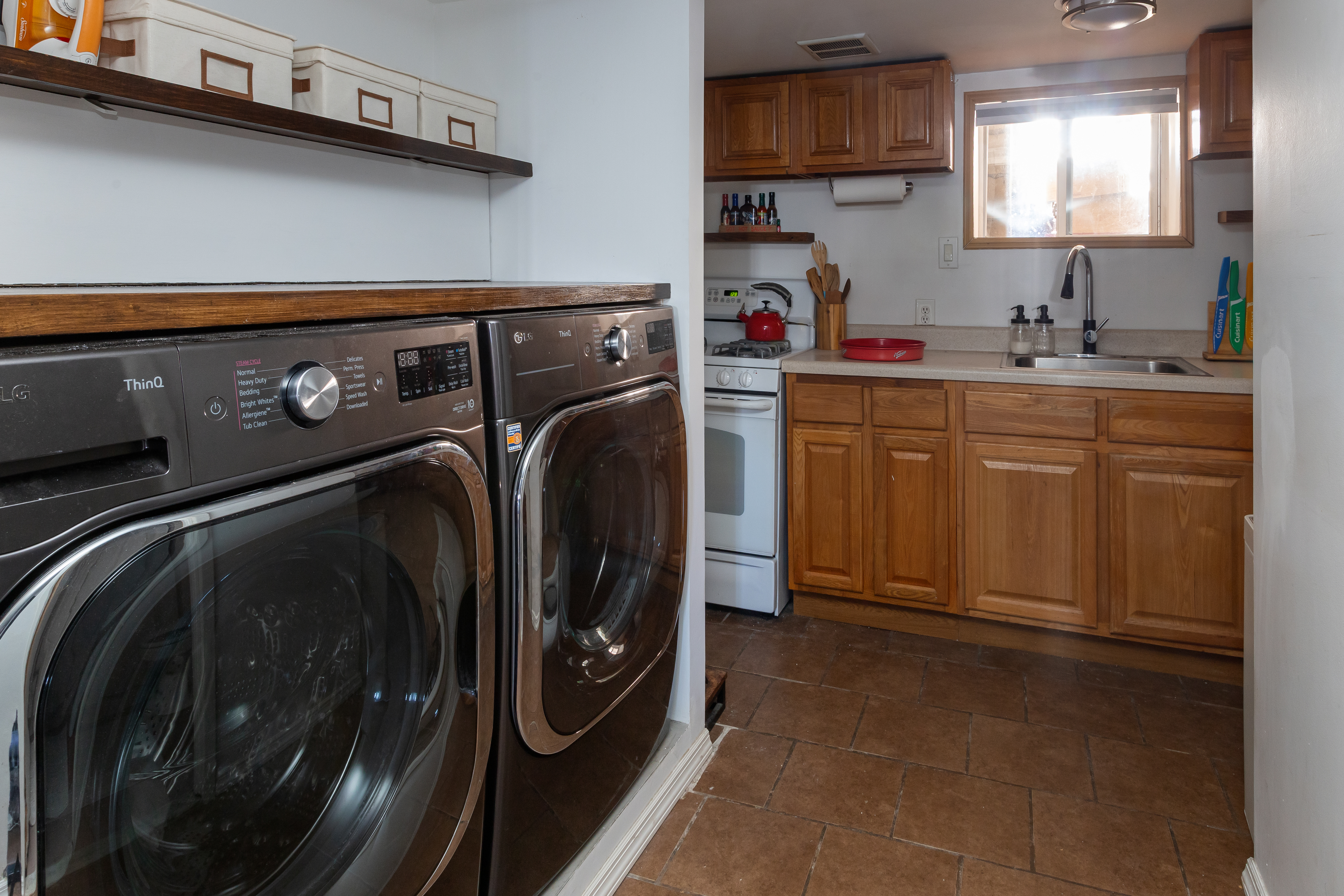 214 Eagle Street Brooklyn, NY 11222 - Photo 20 of 22 a utility room with sink dryer and washer