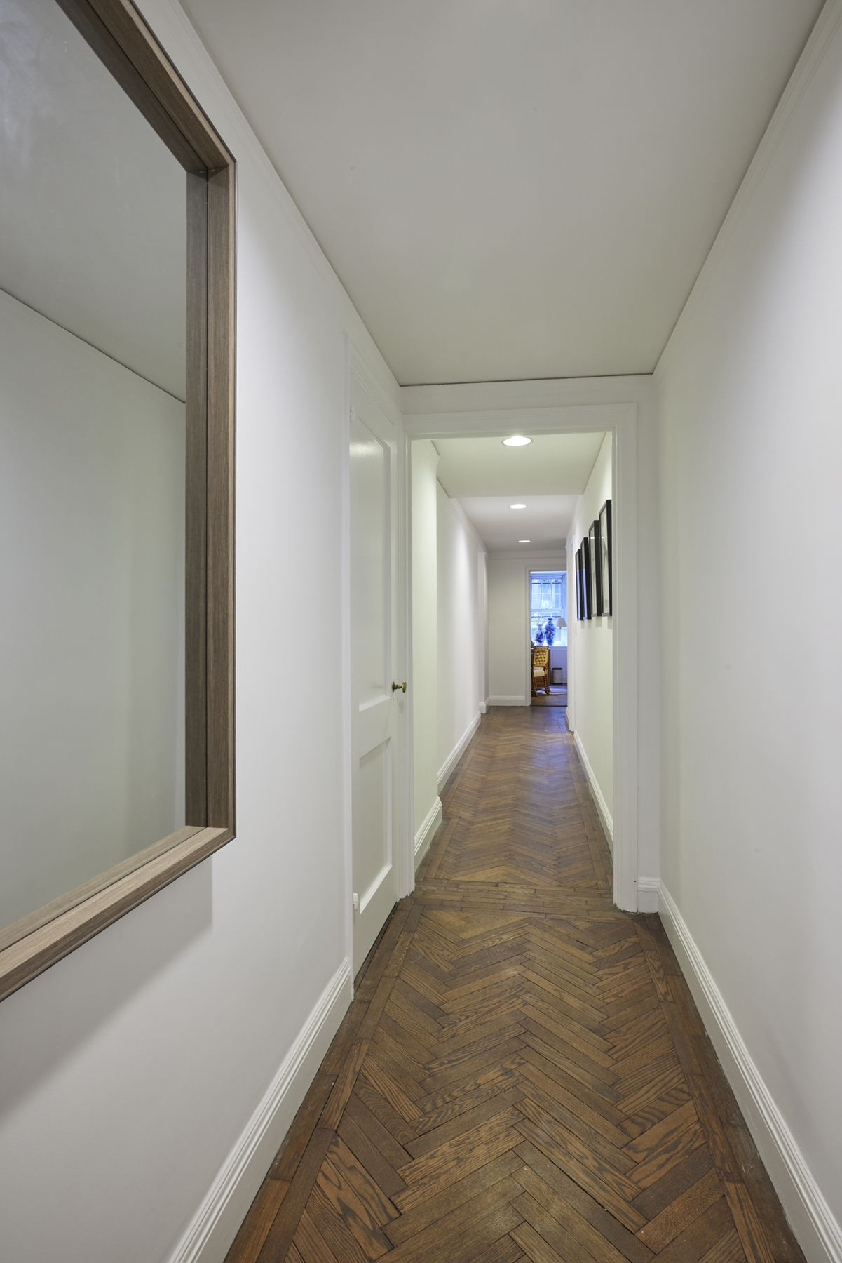 520 East 86th Street, Unit 2D Manhattan, NY 10028 - Photo 11 of 15 a view of a hallway with a livingroom and furniture
