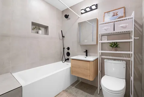 a bathroom with a sink a toilet and bathtub