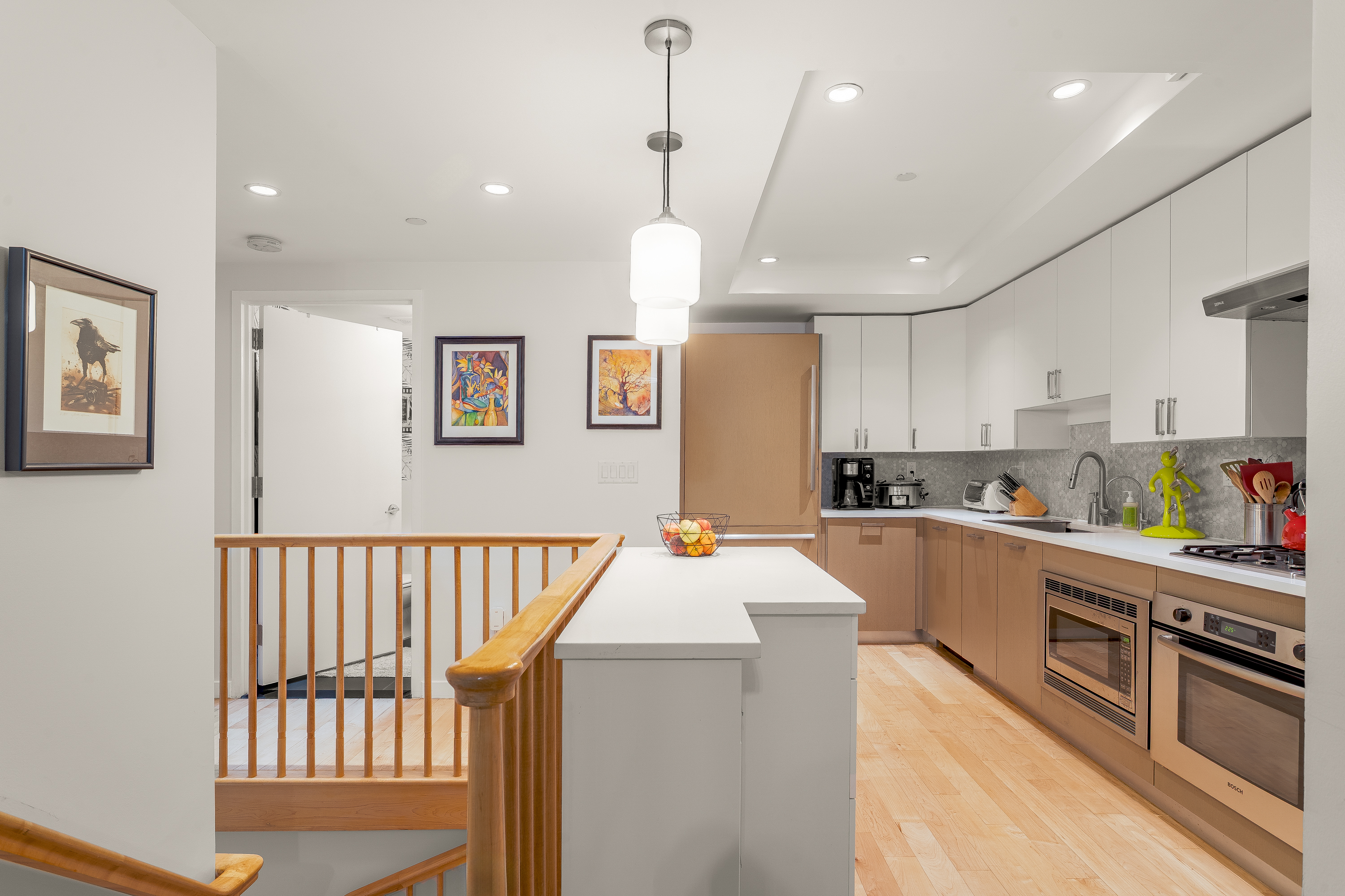 560 Carroll Street, Unit 1D Brooklyn, NY 11215 - Photo 3 of 19 a large kitchen with stainless steel appliances kitchen island granite countertop a refrigerator a stove a sink dishwasher and a dining table with wooden floor