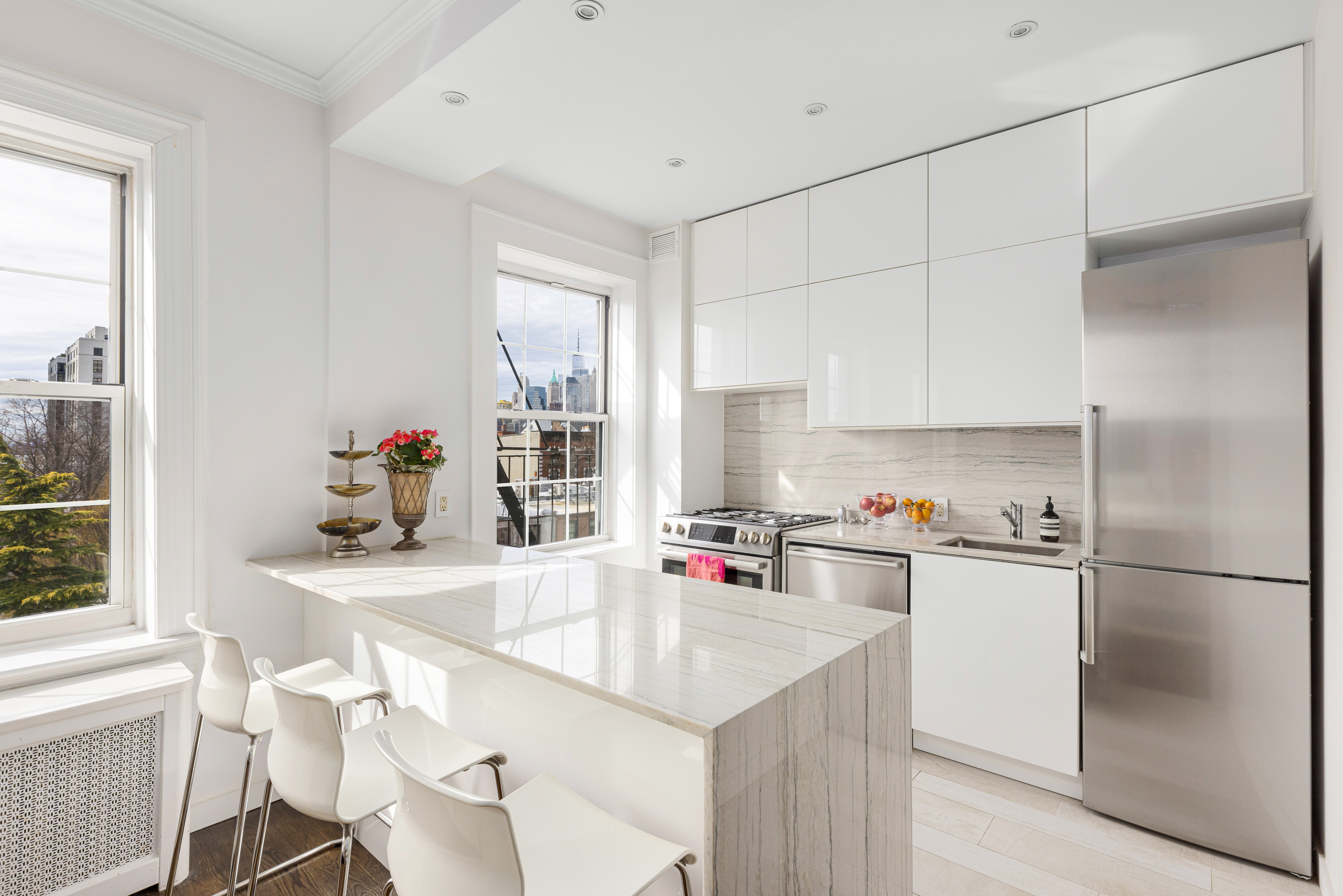 312 Hicks Street, Unit 4 Brooklyn, NY 11201 - Photo 3 of 13 a kitchen with a refrigerator a sink and cabinets