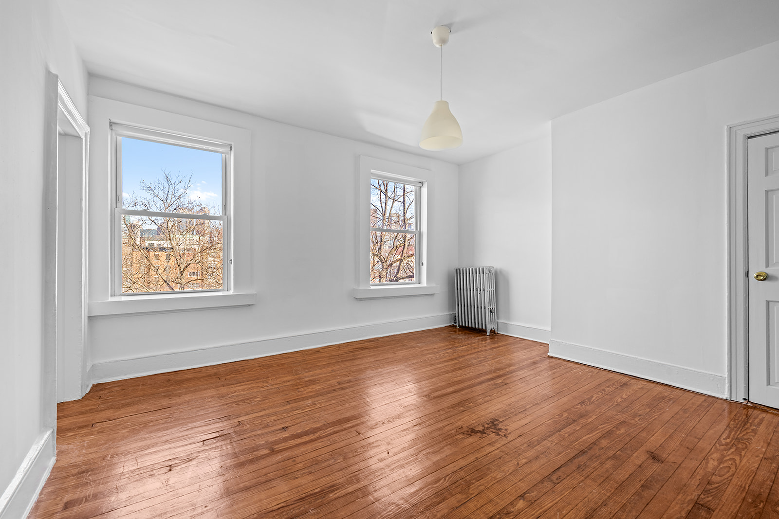 44 Butler Street Brooklyn, NY 11231 - Photo 14 of 22 a view of an empty room with wooden floor and a window
