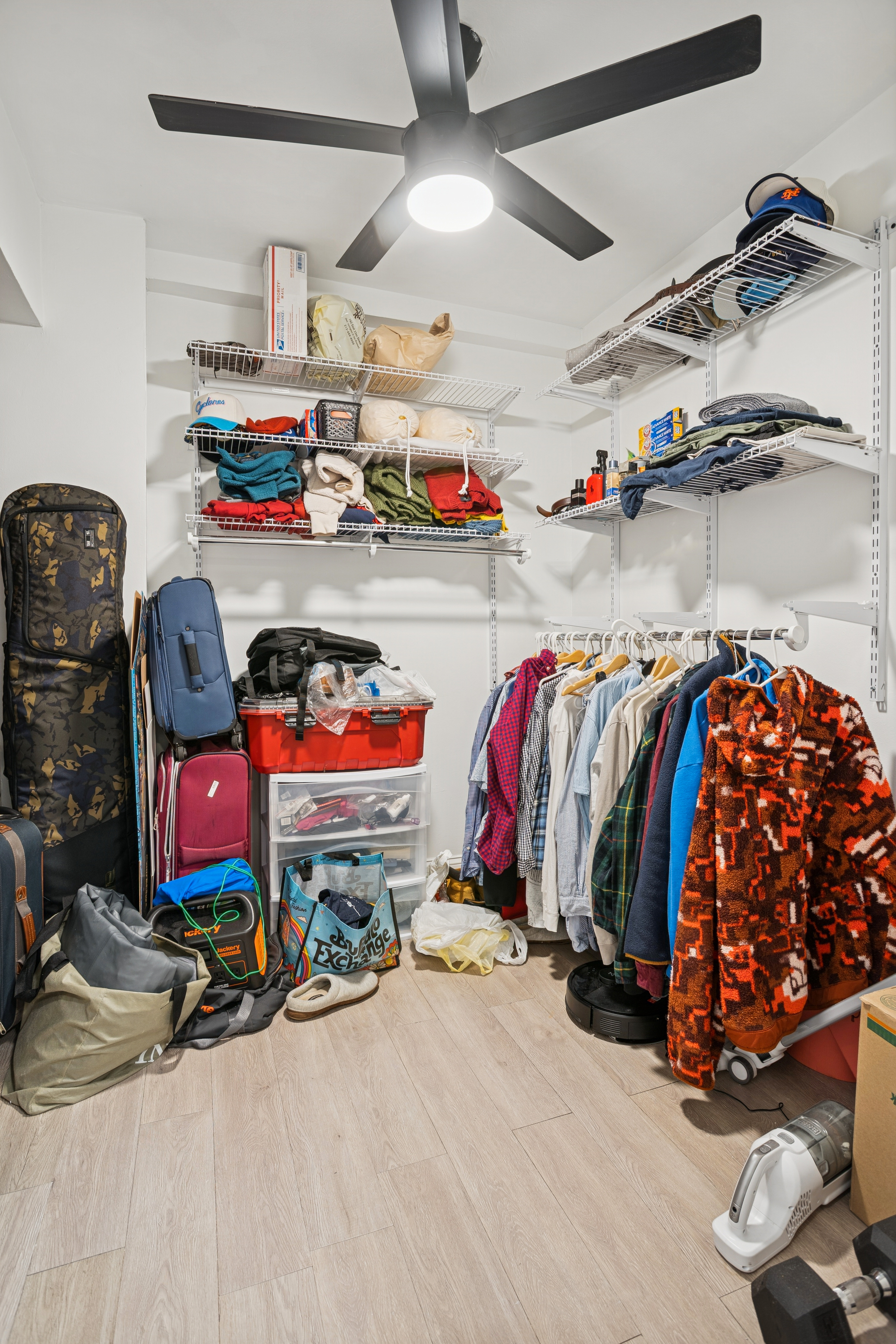 141 East 55th Street, Unit 4C Manhattan, NY 10022 - Photo 6 of 7 a view of walk in closet with clothes and shoes