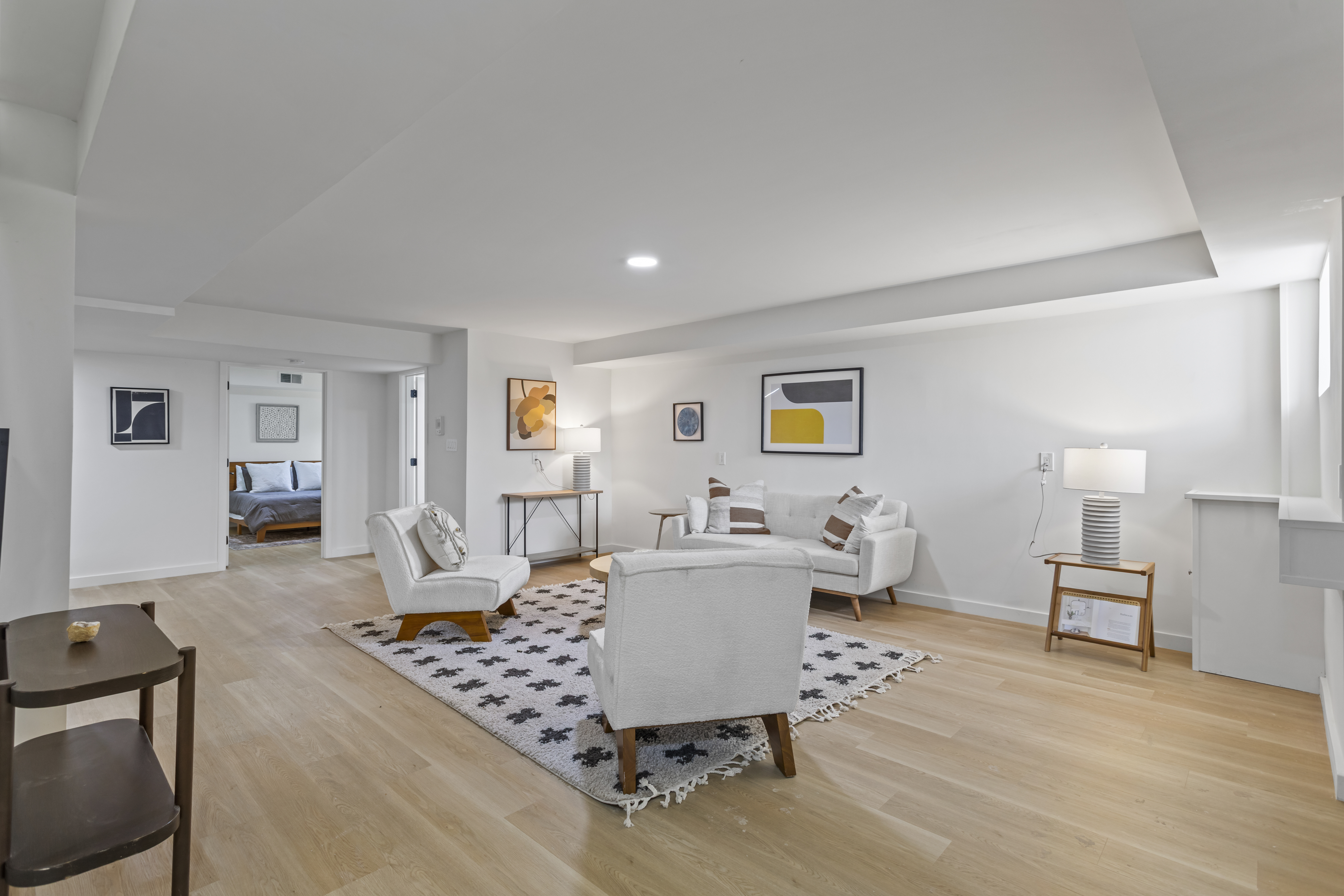 3112 Emmons Avenue, Unit 3124A2 Brooklyn, NY 11235 - Photo 8 of 17 a living room with furniture and wooden floor