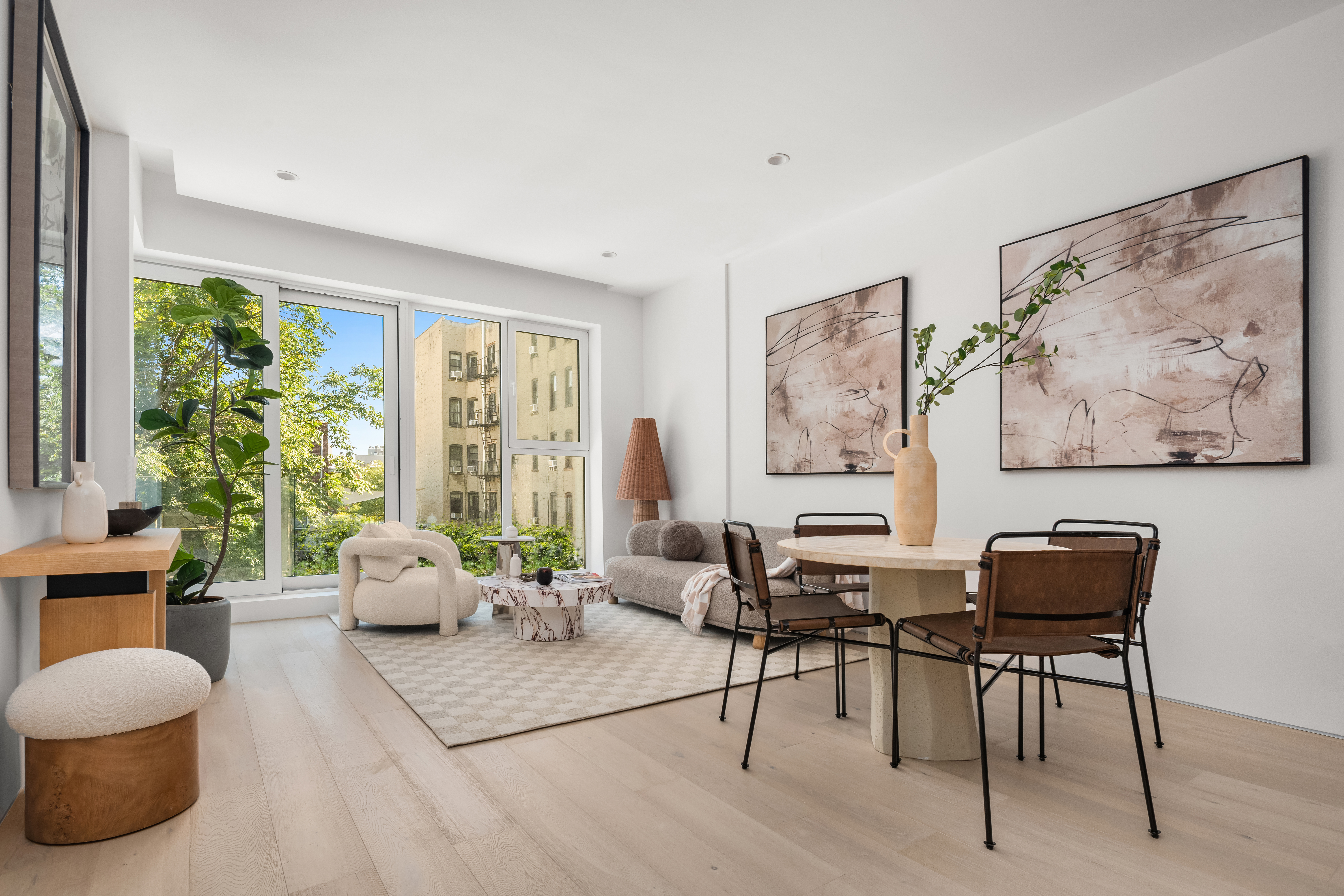 79 South 2nd Street, Unit 2 Brooklyn, NY 11249 - Photo 1 of 14 a living room with furniture and a large window