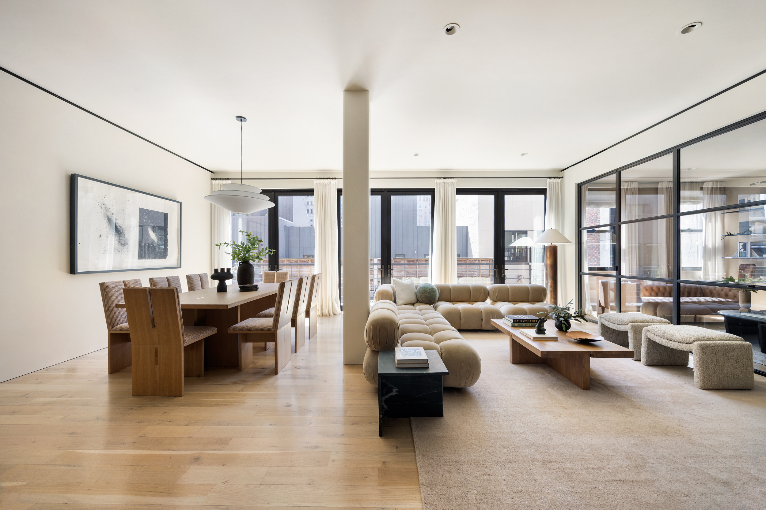 110 Duane Street, Unit PH3S Manhattan, NY 10007 - Photo 2 of 23 a living room with furniture and large windows