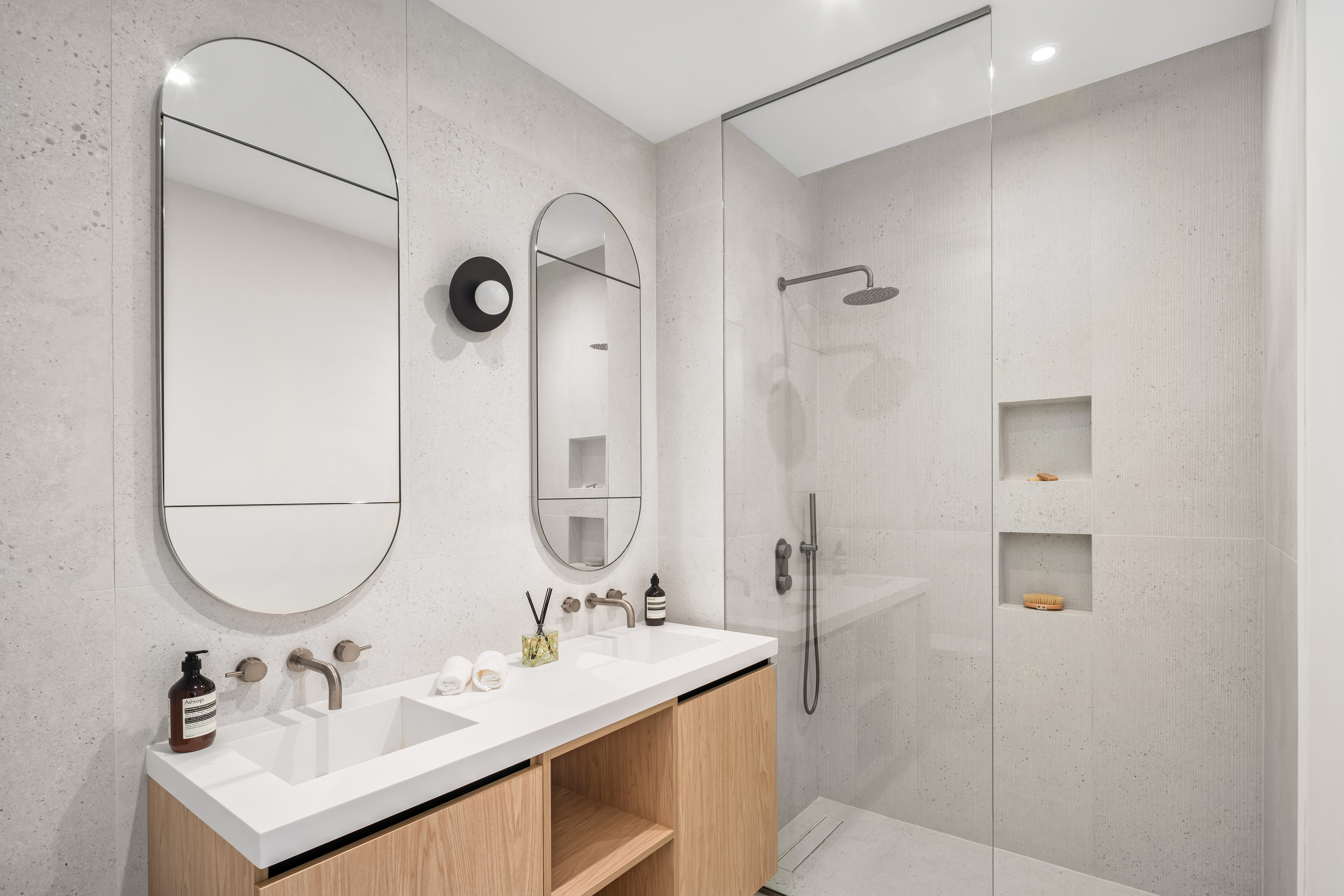 79 South 2nd Street, Unit 2 Brooklyn, NY 11249 - Photo 5 of 14 a bathroom with a sink vanity tub and a mirror