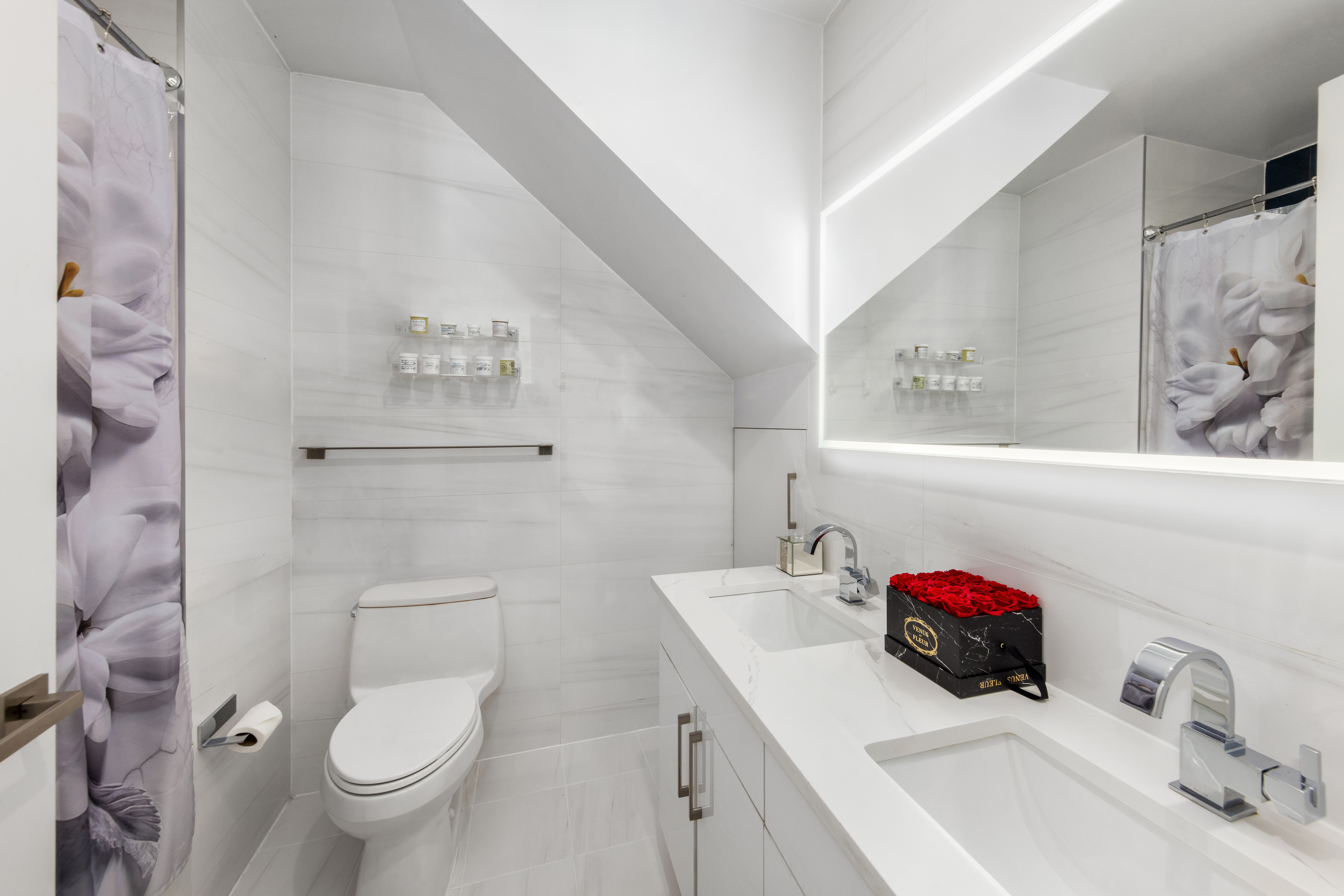 42-44 Crescent Street, Unit PHB Queens, NY 11101 - Photo 7 of 11 a bathroom with a sink toilet and shower