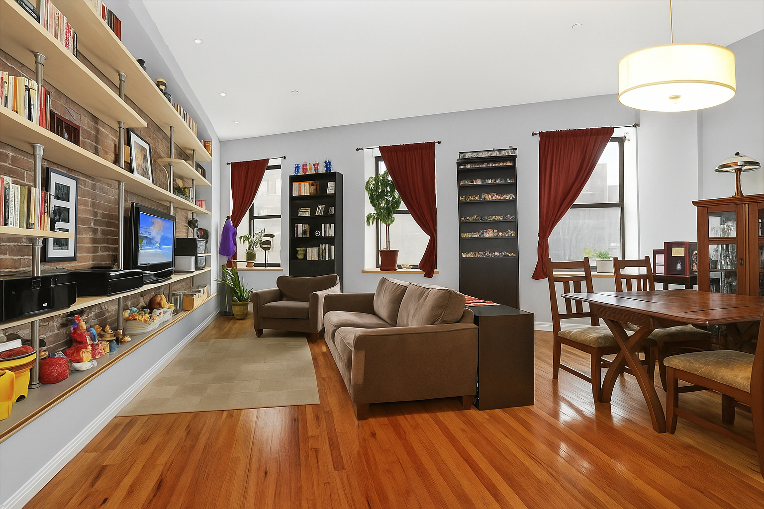 560 State Street, Unit 7A Brooklyn, NY 11217 - Photo 1 of 3 a living room with furniture and a flat screen tv