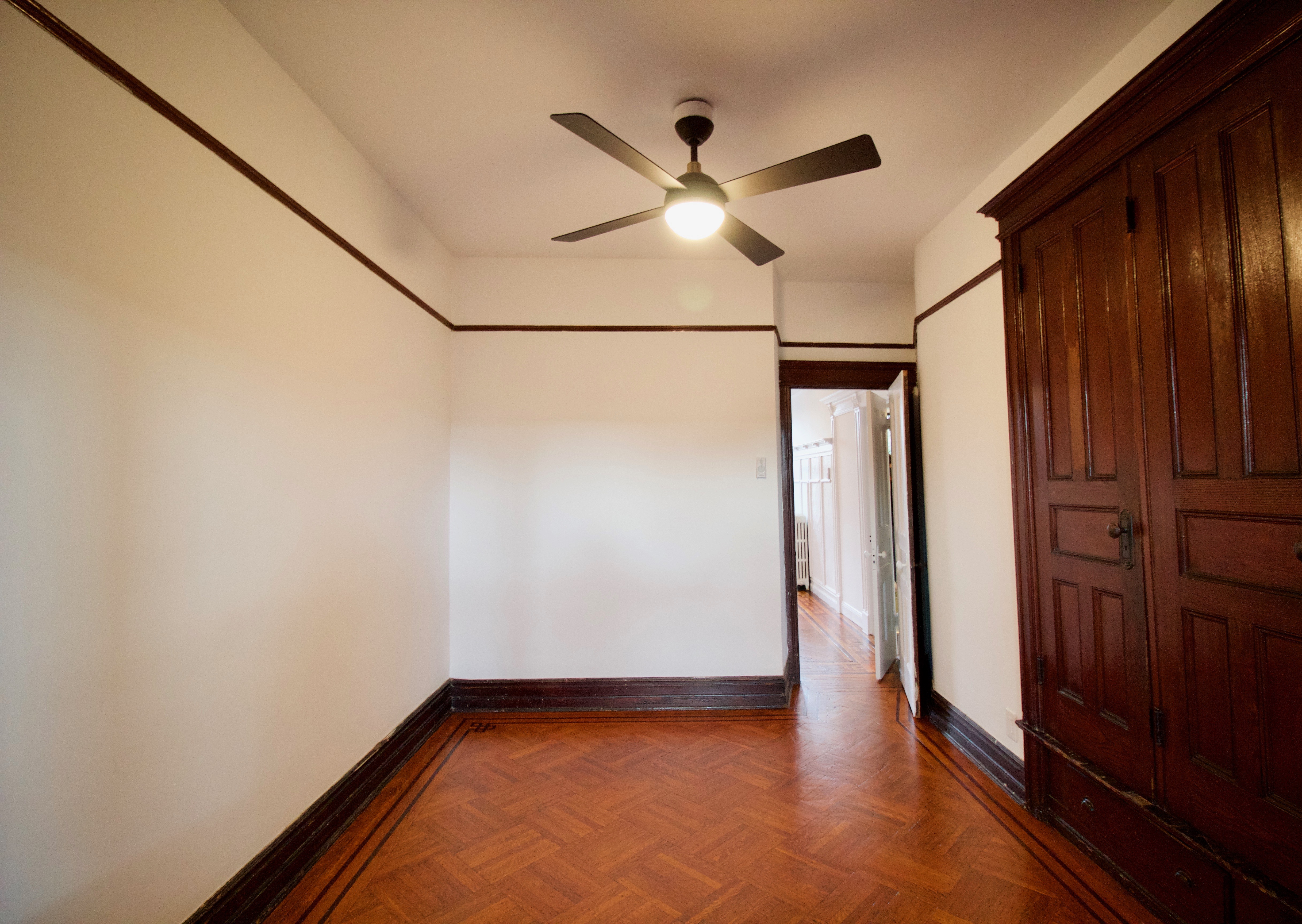 403 Caton Avenue, Unit 3 Brooklyn, NY 11218 - Photo 15 of 31 a view of empty room with wooden floor