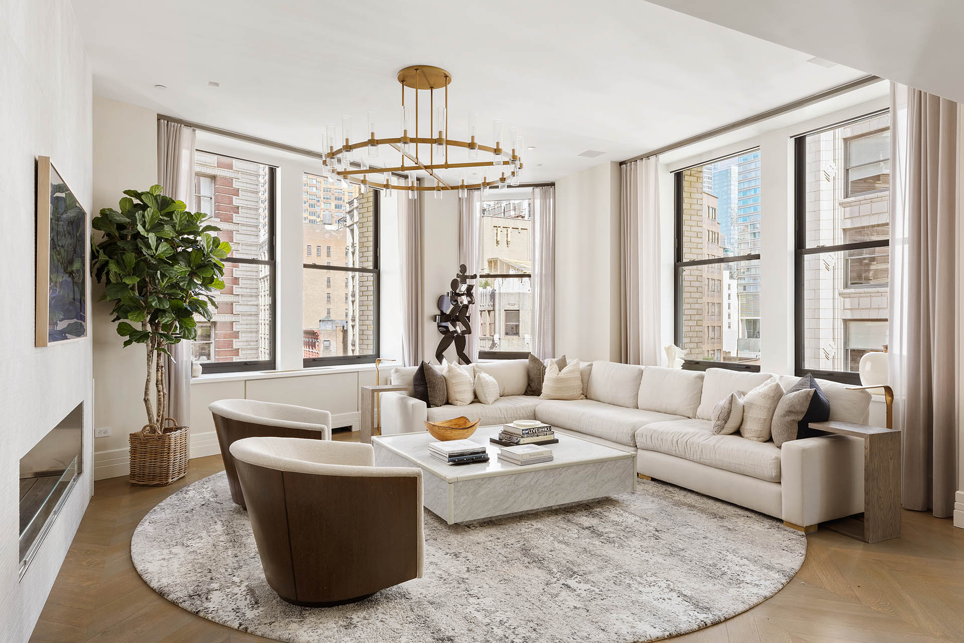 212 5th Avenue, Unit 9B Manhattan, NY 10010 - Photo 3 of 16 a living room with furniture and a large window
