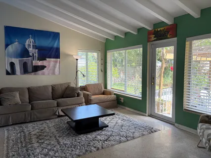 a kitchen with a sink cabinets and window