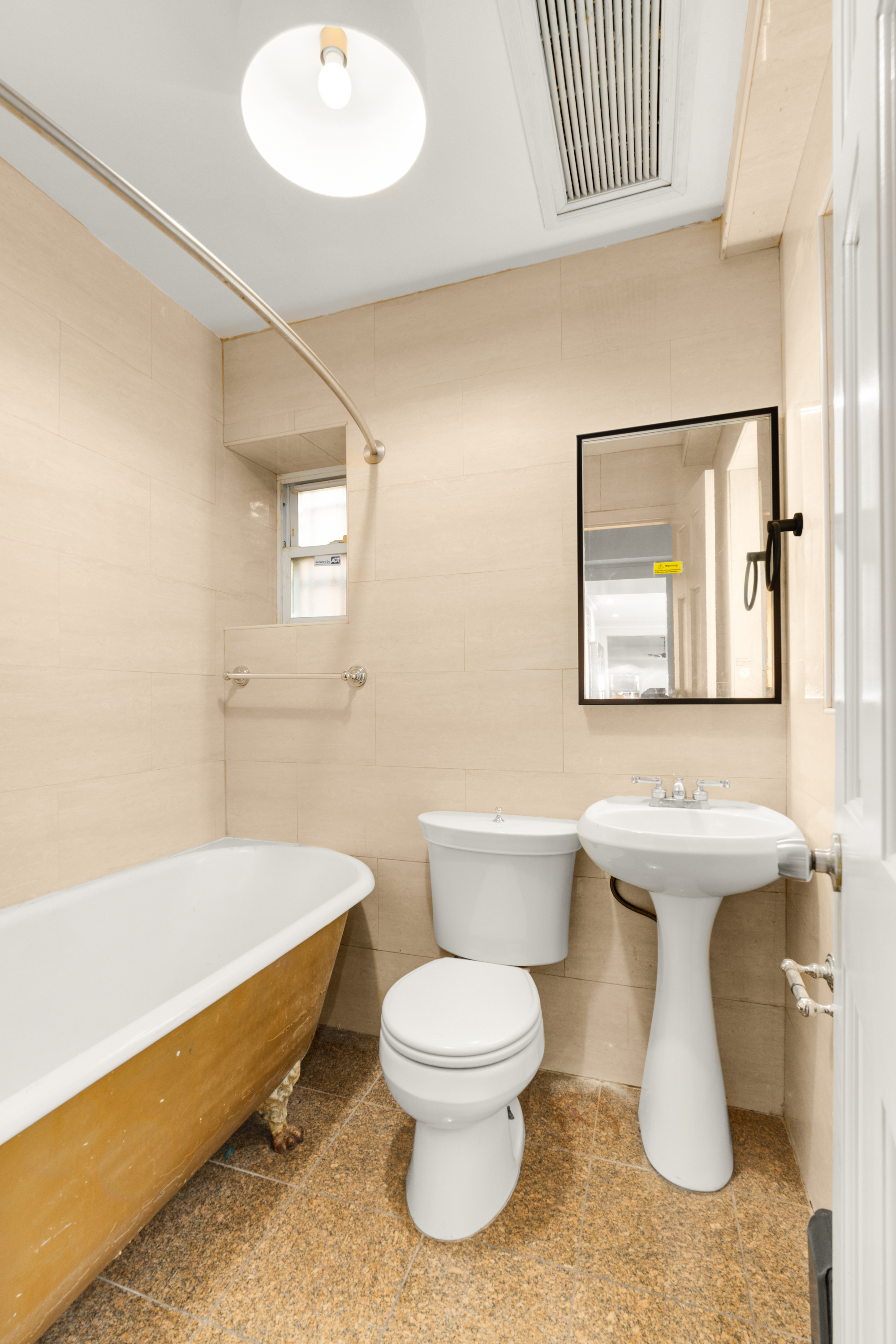 688 Saint Marks Avenue, Unit GARDEN Brooklyn, NY 11216 - Photo 12 of 13 a bathroom with a toilet sink and mirror