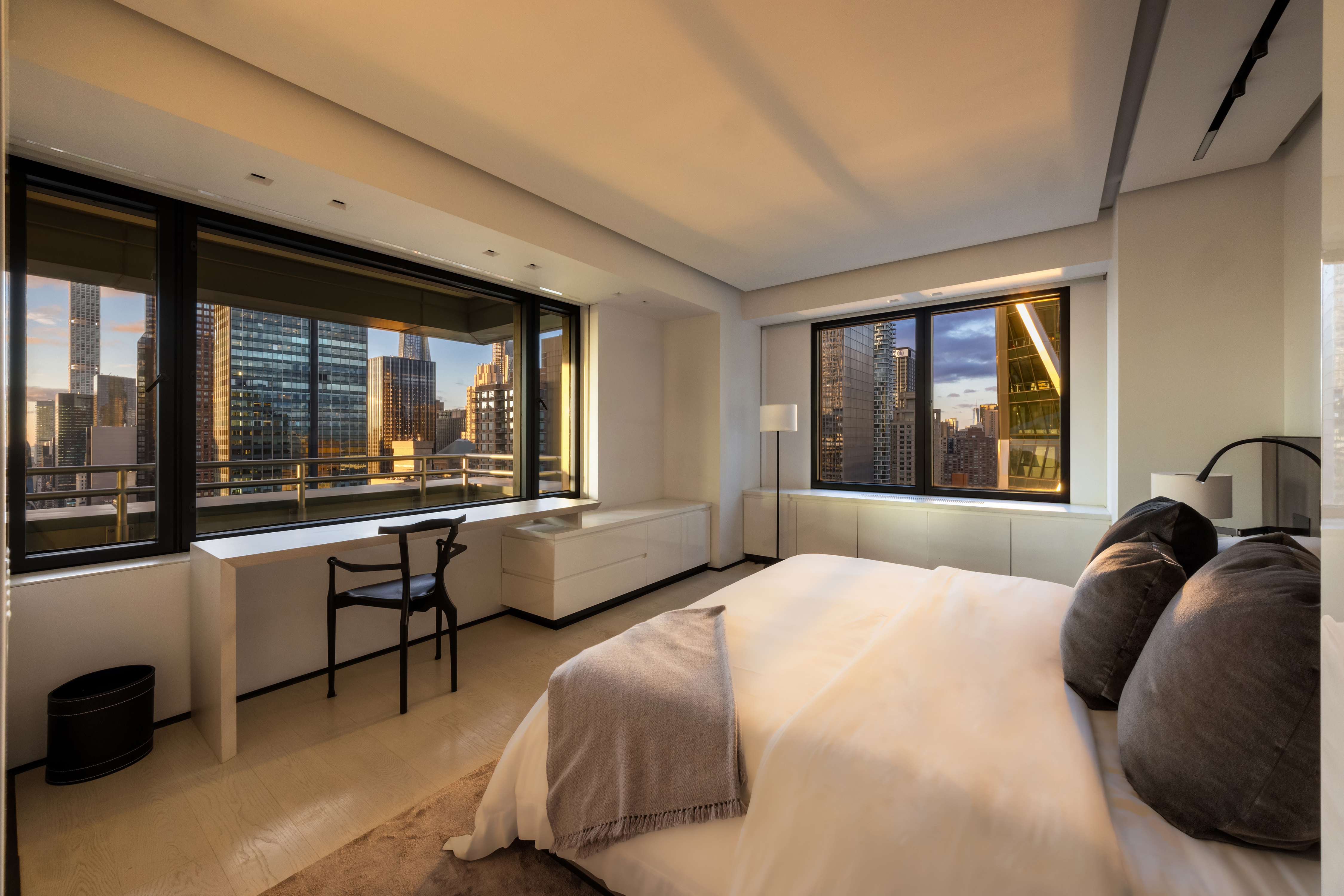 301 West 57th Street, Unit 36C Manhattan, NY 10019 - Photo 20 of 27 a bedroom with a bed and a large window