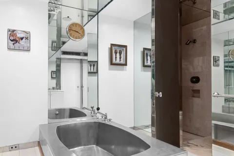 a bathroom with a sink and a mirror