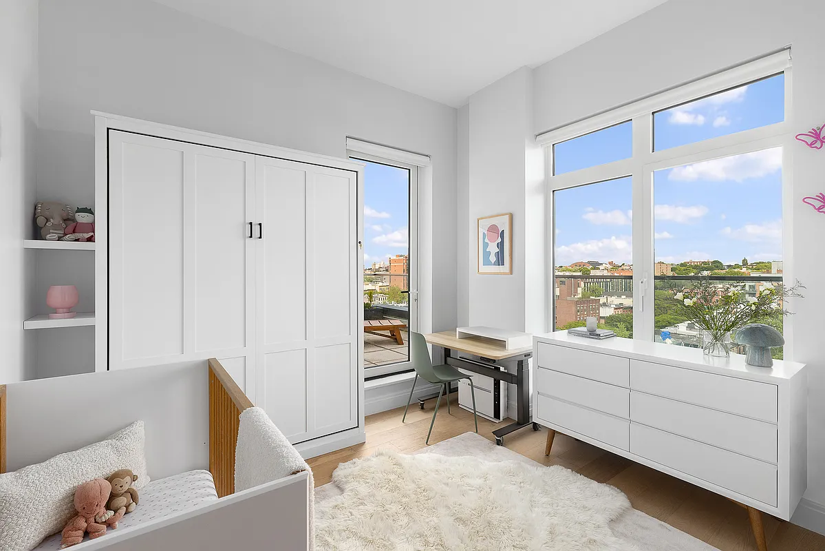 181 18th Street, Unit 1002 Brooklyn, NY 11215 - Photo 8 of 19 a living room with furniture and a large window