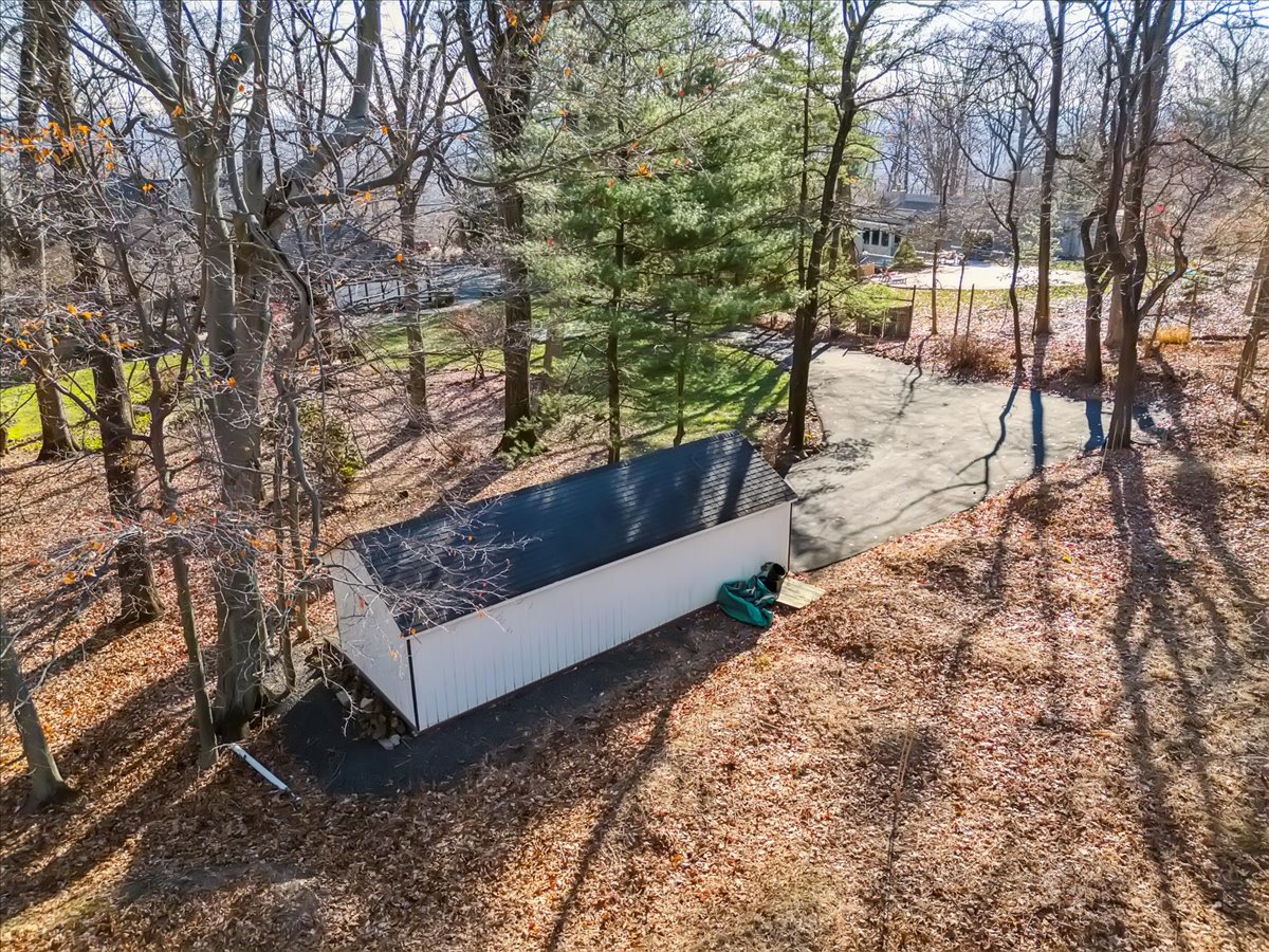 Johnston Drive Watchung, NJ 07069 - Photo 75 of 85 a view of a bench in a yard with large trees