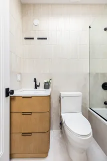 a bathroom with a toilet and a sink