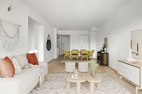 a living room with furniture a dining table and a fireplace