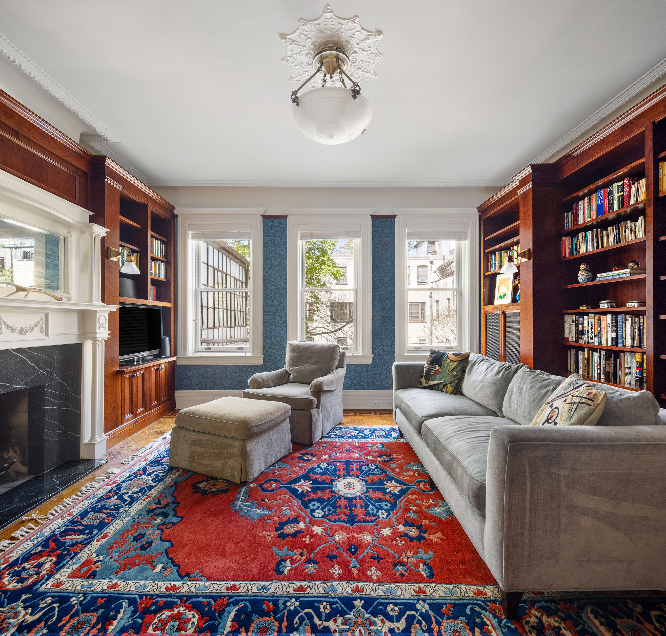 577 4th Street Brooklyn, NY 11215 - Photo 13 of 22 a living room with fireplace furniture and a rug
