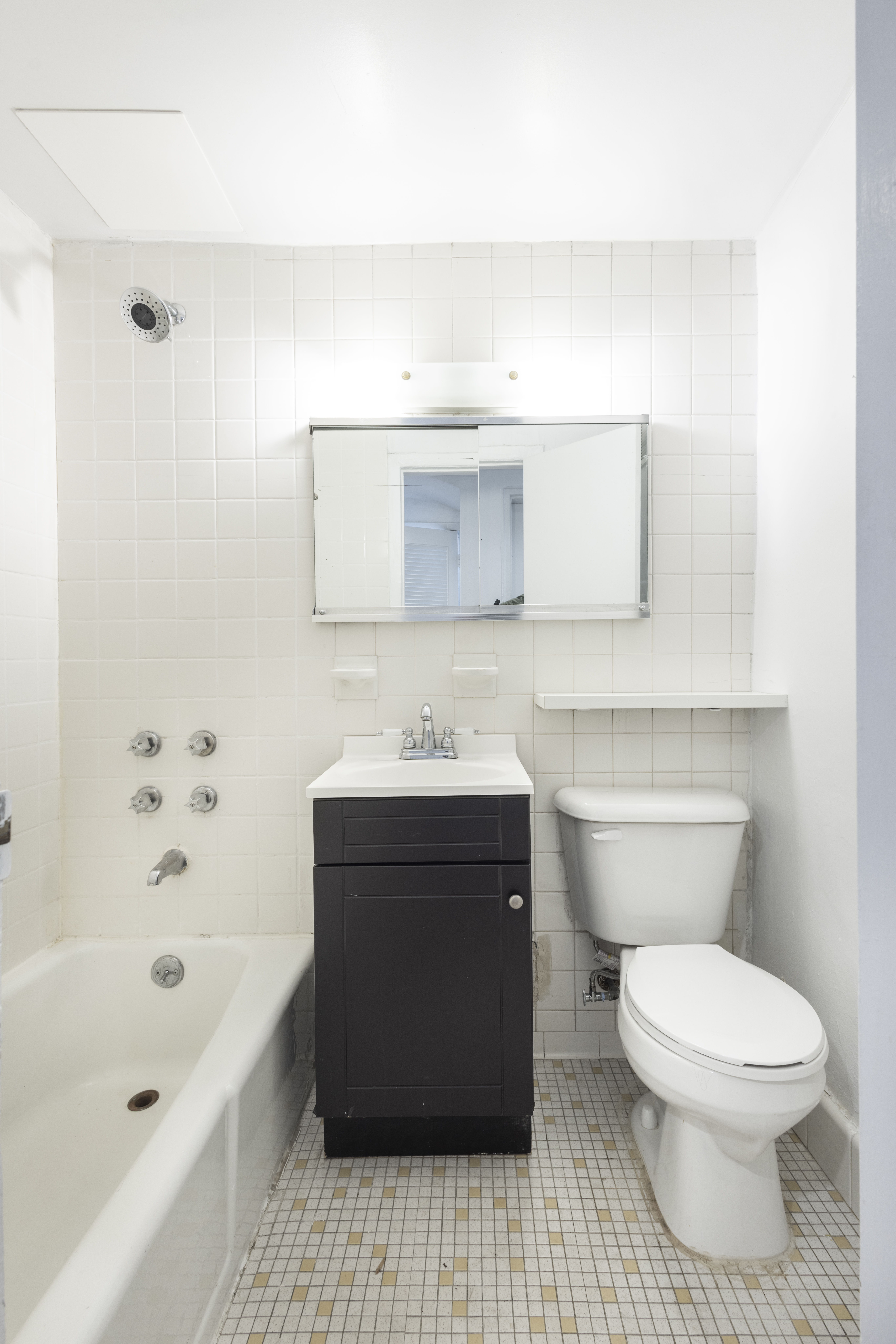 145 State Street, Unit 1 Brooklyn, NY 11201 - Photo 10 of 12 a bathroom with a sink a toilet and bathtub