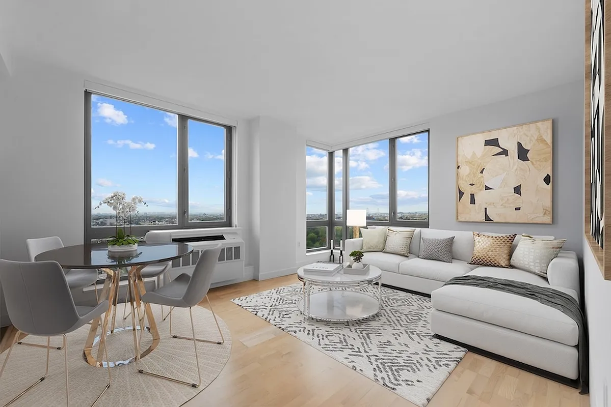 a living room with furniture and a large window