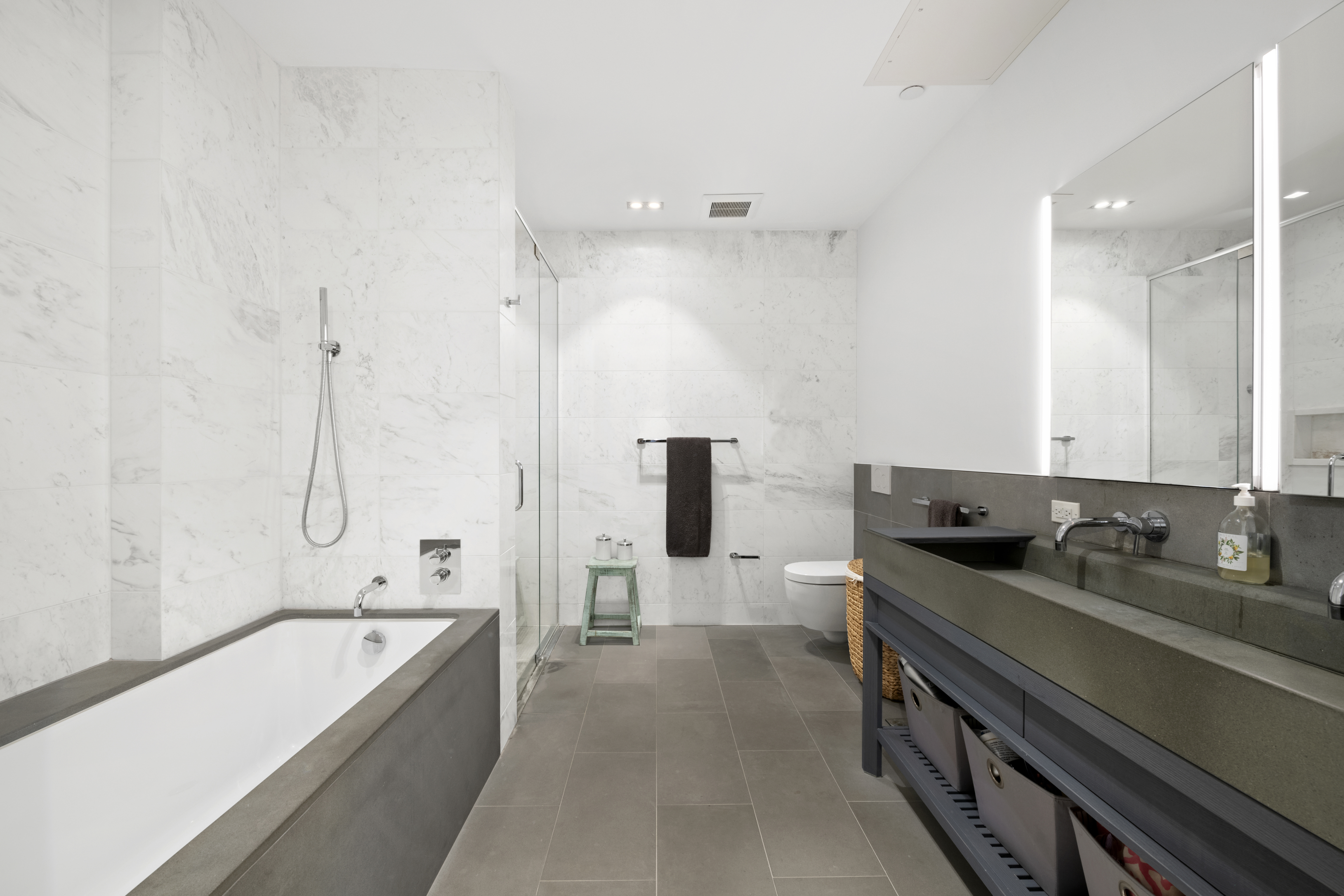 225 West 17th Street, Unit 6B Manhattan, NY 10011 - Photo 6 of 11 a bathroom with a tub sink and mirror