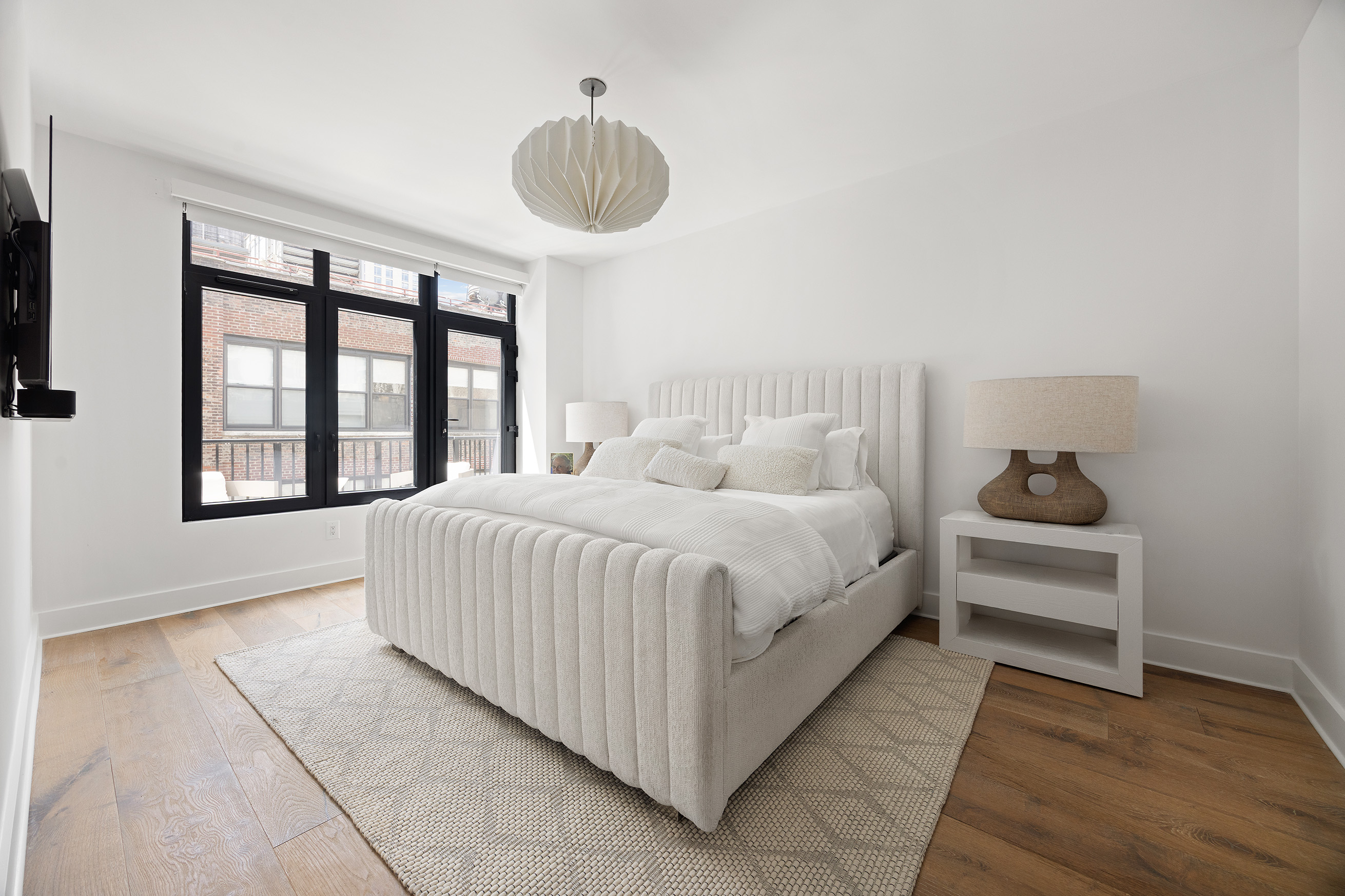128 West 26th Street, Unit PH Manhattan, NY 10001 - Photo 11 of 21 a bedroom with a bed and a window