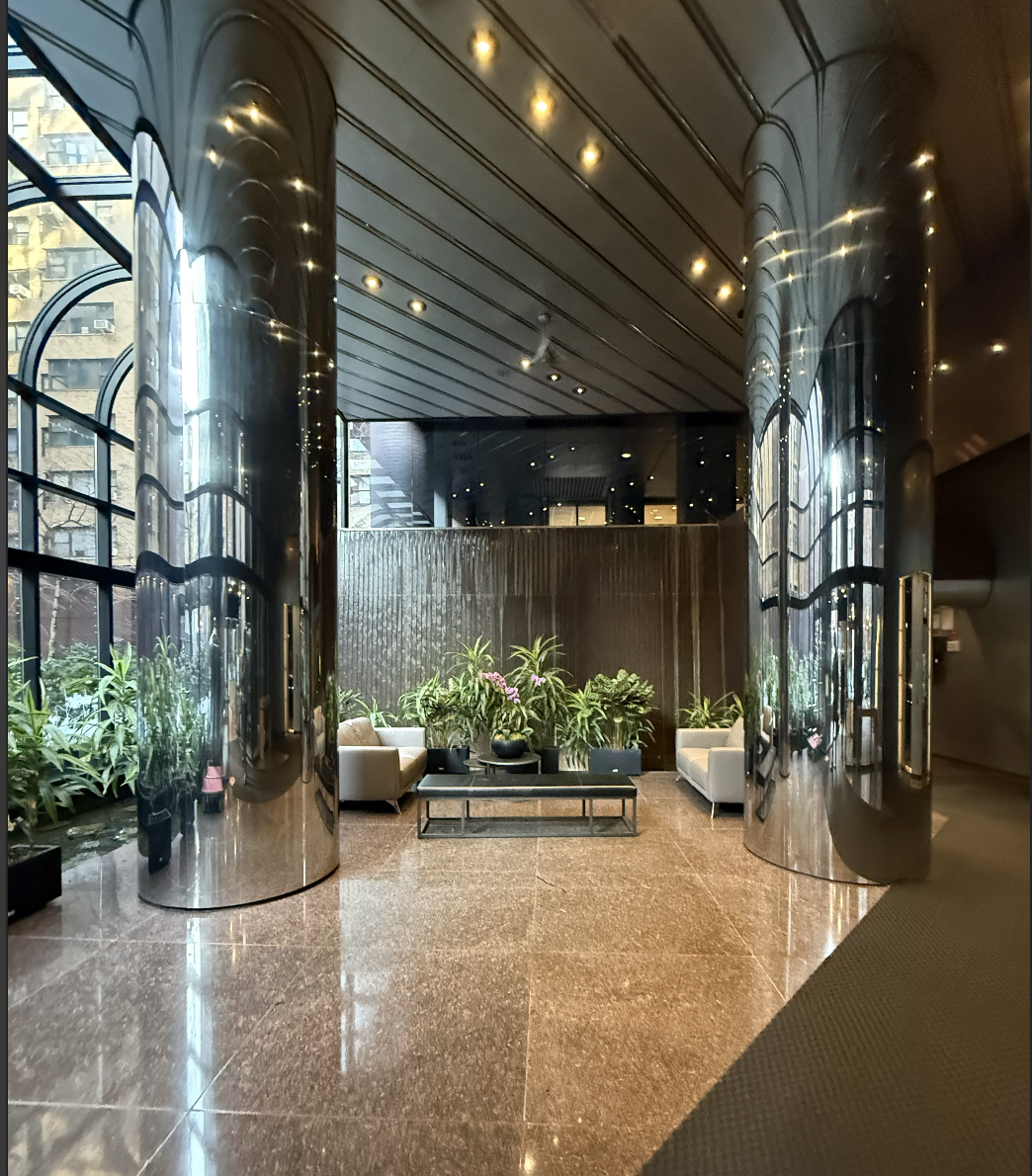 415 East 54th Street, Unit 6D Manhattan, NY 10022 - Photo 14 of 18 a room with lots of potted plants
