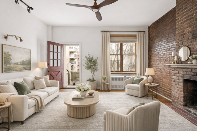 127 West 95th Street Manhattan, NY 10025 - Photo 2 of 15 a living room with furniture and a fireplace