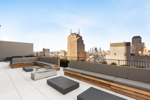 a terrace with a bench and a couch