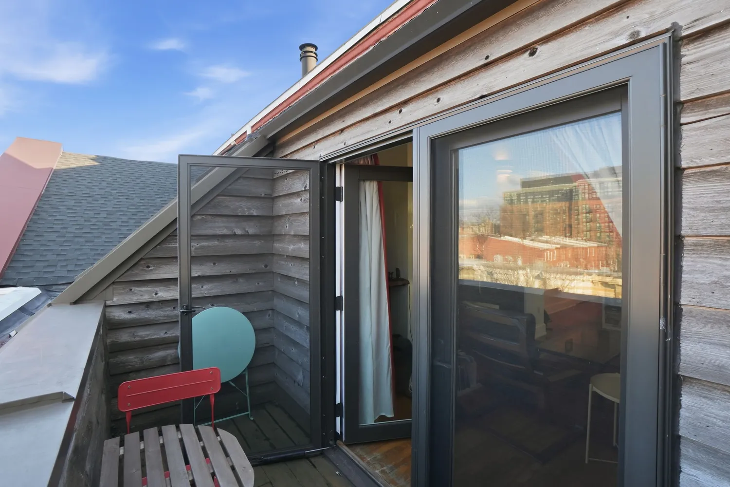 a view of balcony with wooden floor