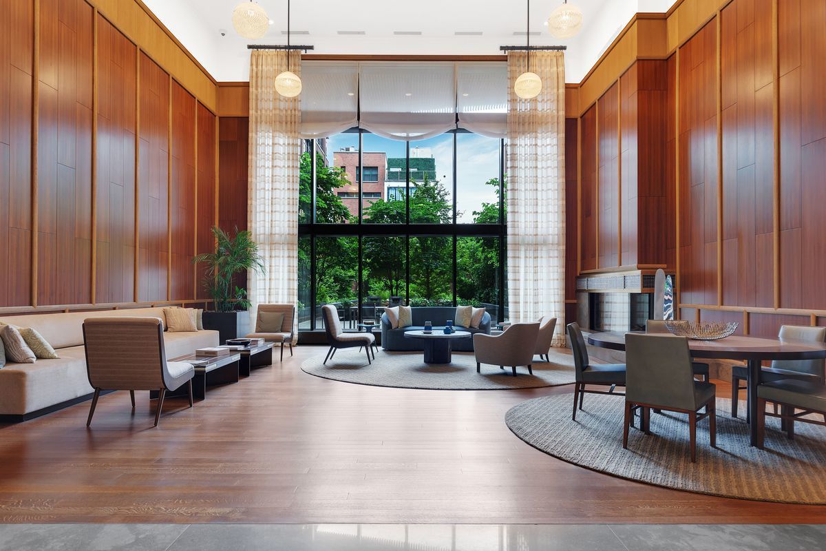 150 Charles Street, Unit 14B Manhattan, NY 10014 - Photo 15 of 20 a living room with furniture and large windows